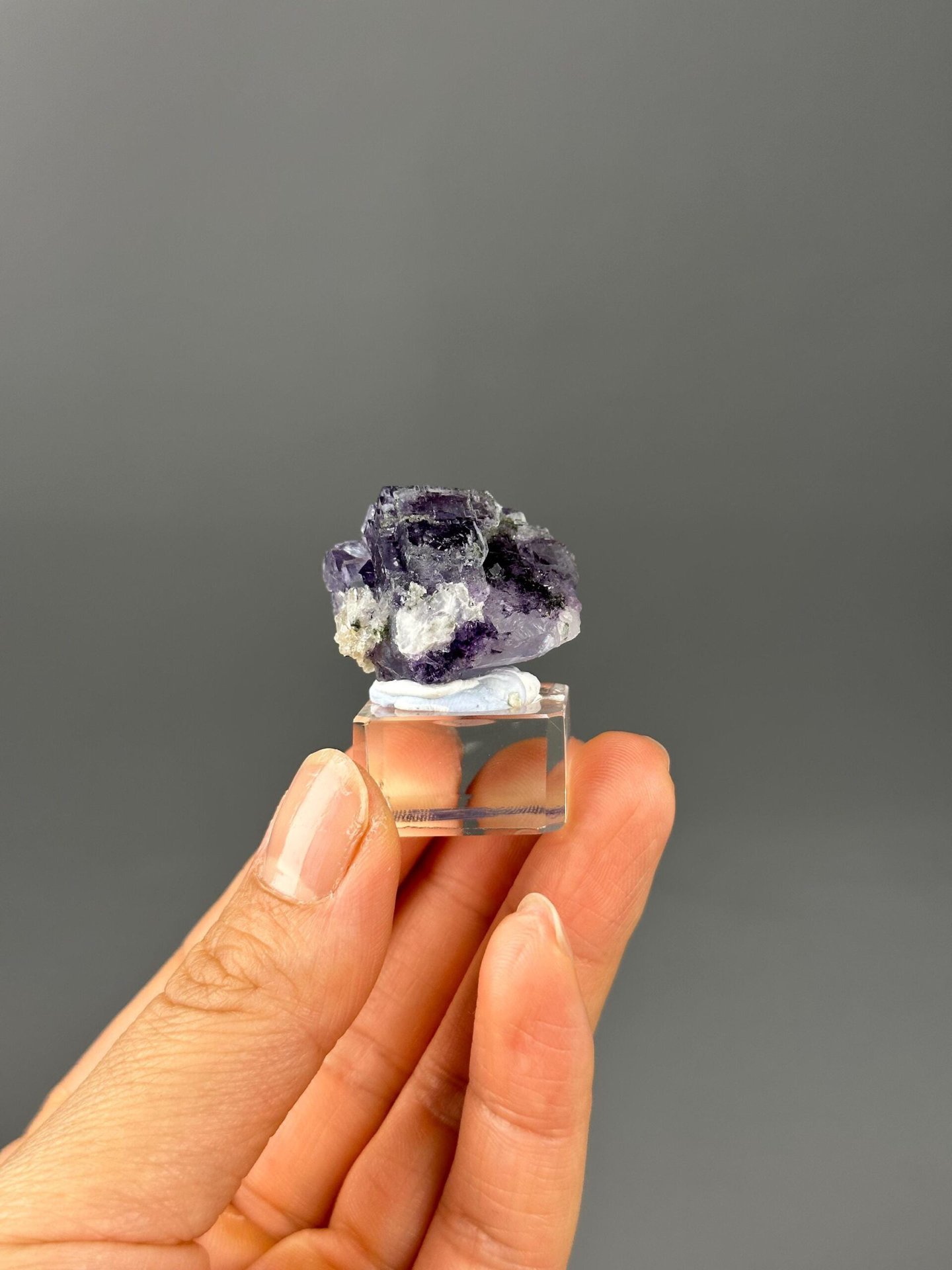 Full purple fluorite quartz specimen on white background