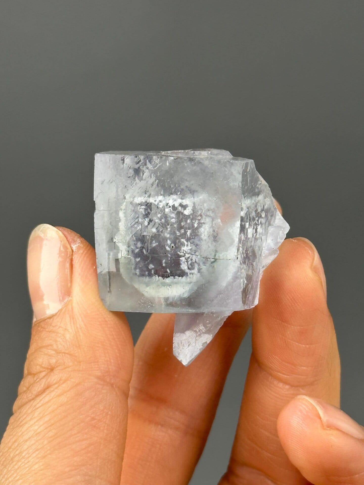 Purple phantom zoning in blue fluorite crystal