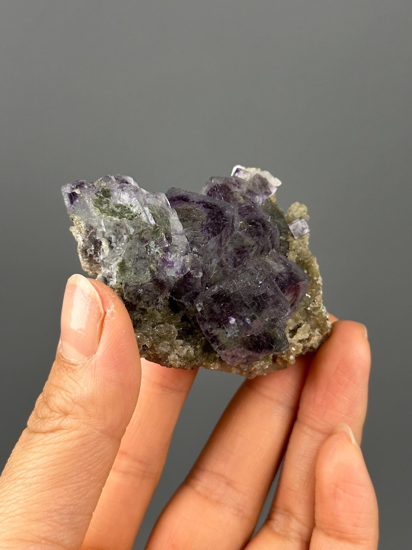 White dolomite matrix beneath deep purple fluorite