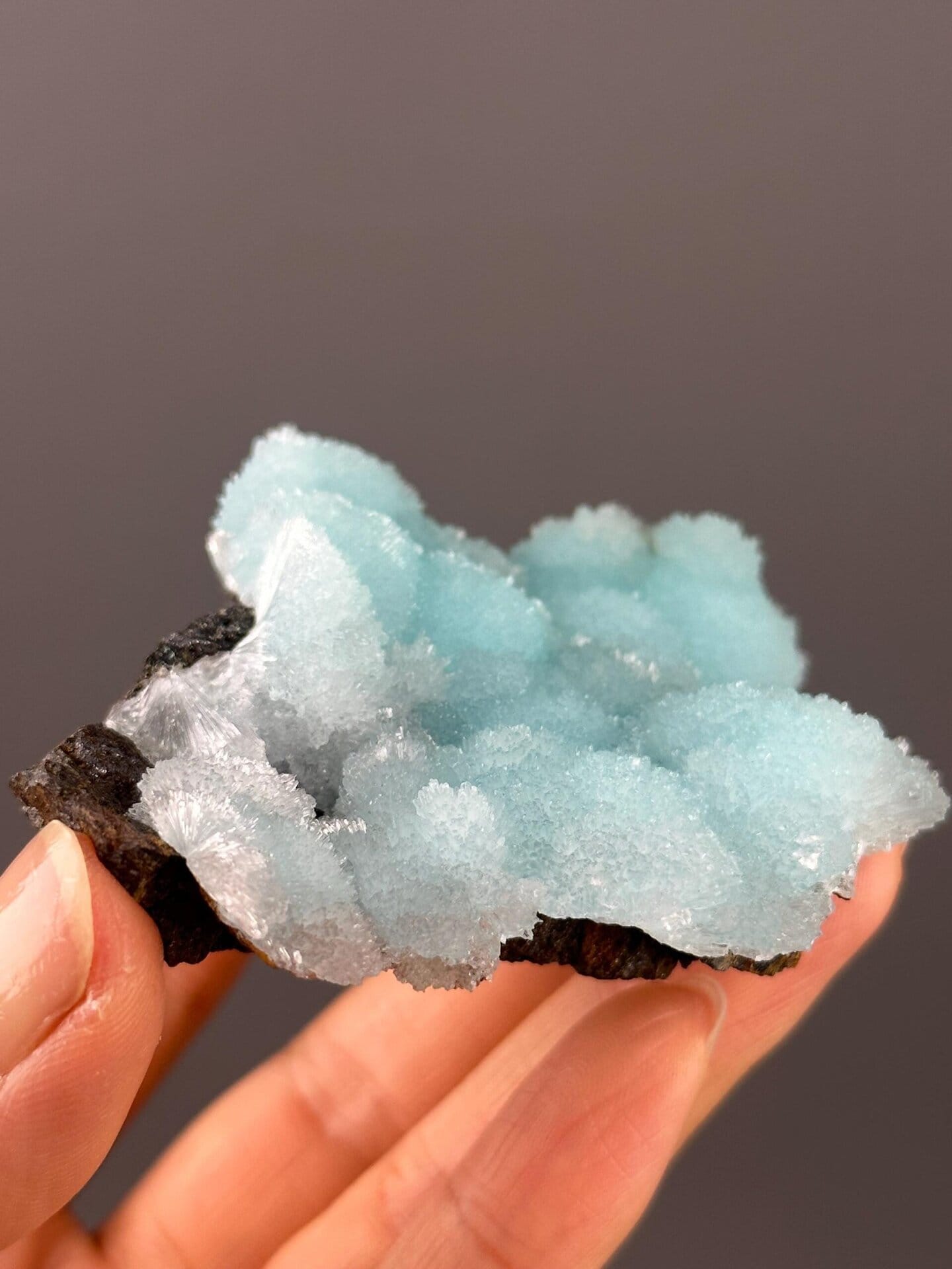Side view of blue aragonite crystal cluster