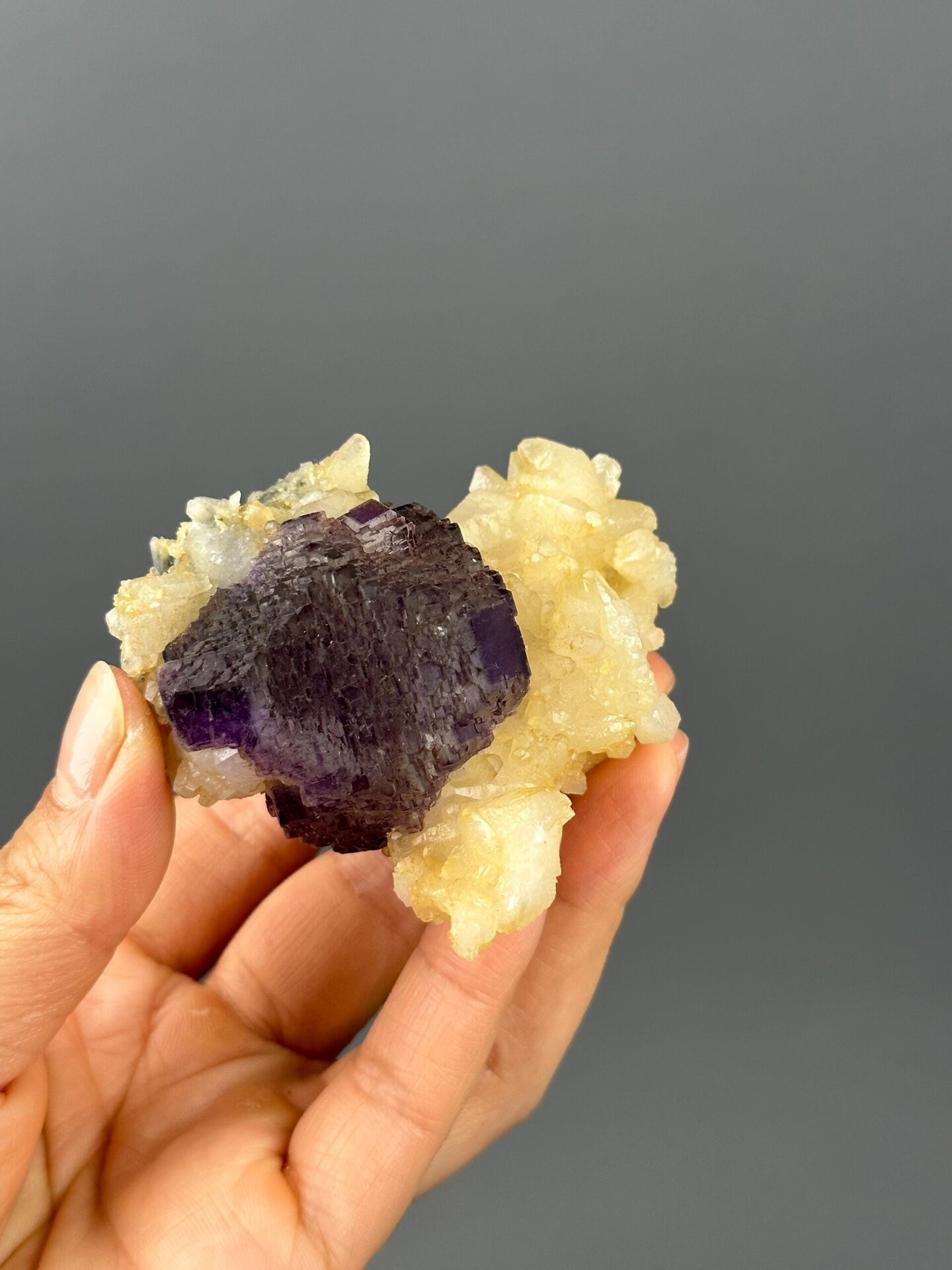 Close-up of etched crystal surfaces on purple fluorite