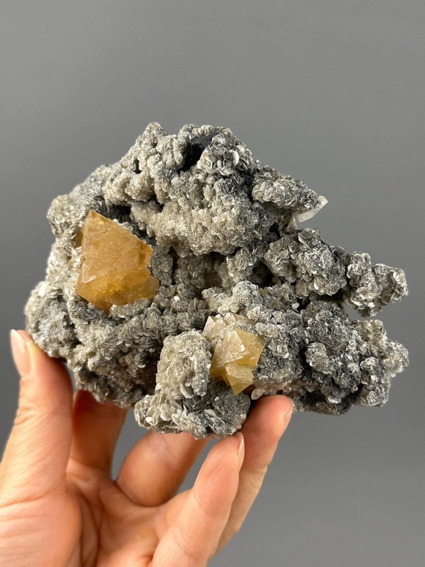 Orange-yellow scheelite octahedral crystal close-up