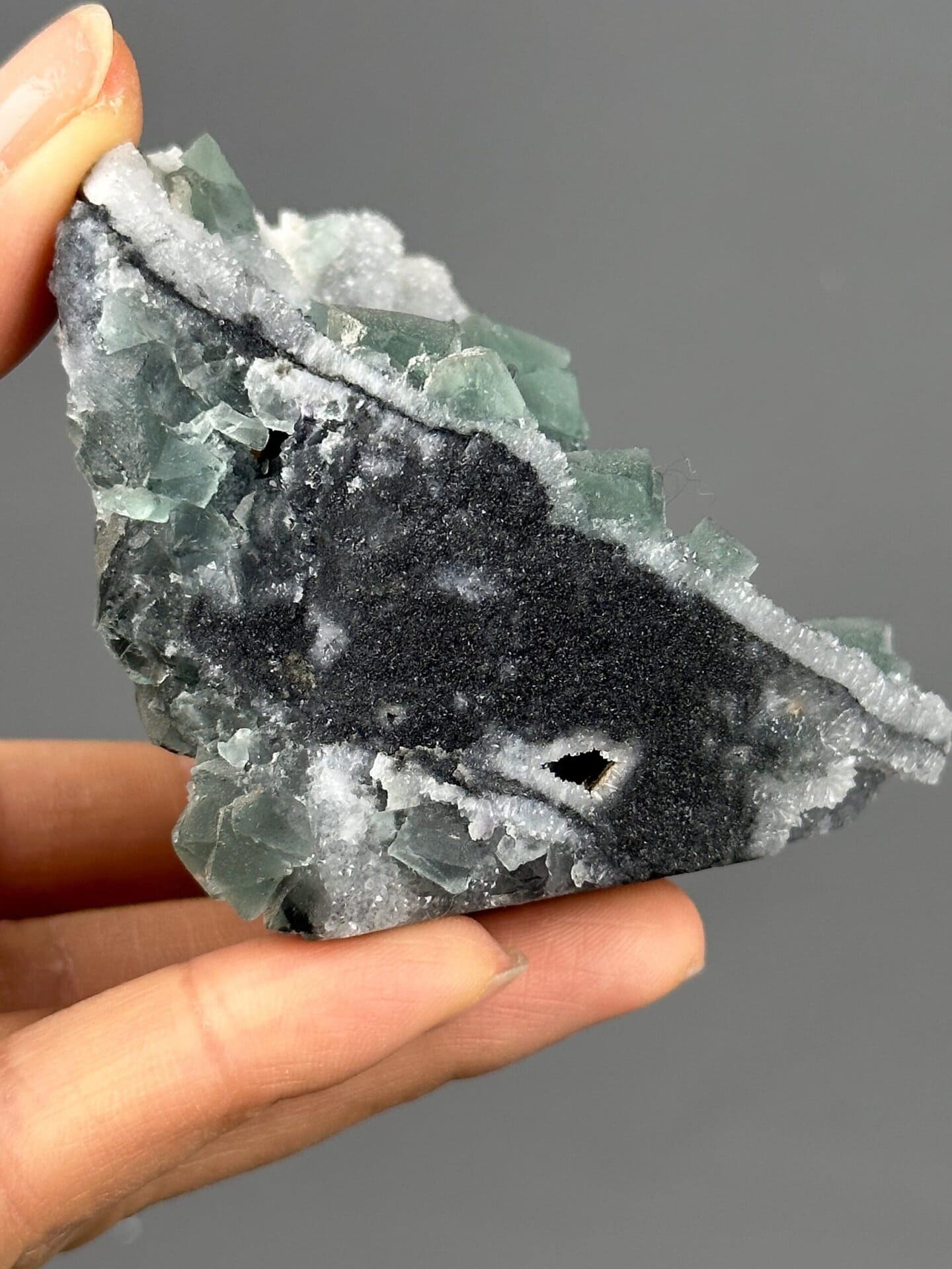 Fluorite octahedral form under quartz coating