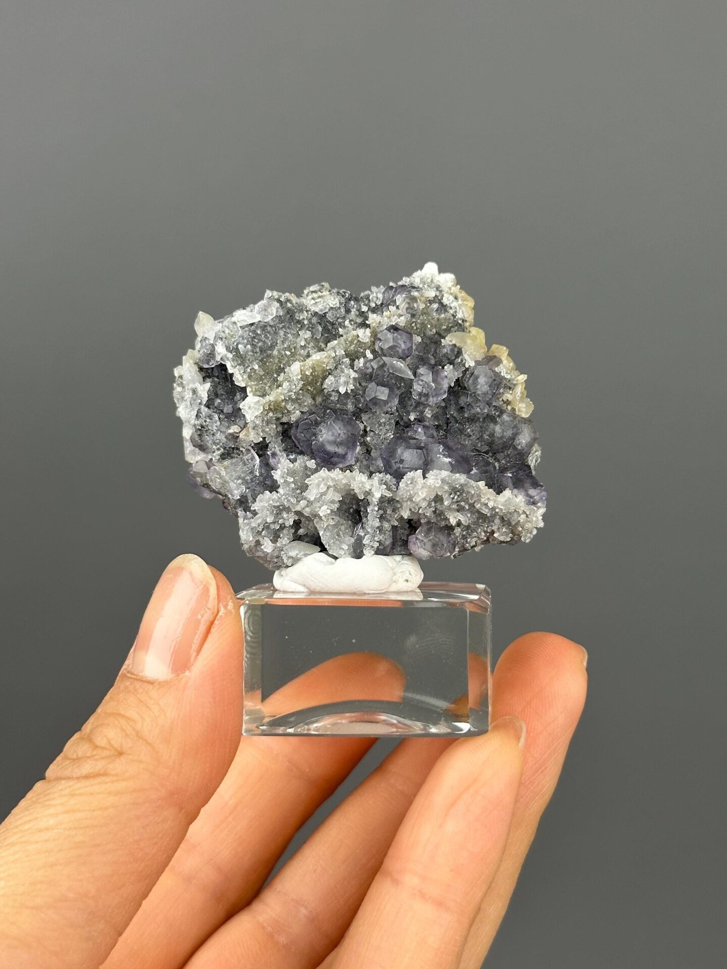 Front view of multi-mineral fluorite quartz calcite cluster