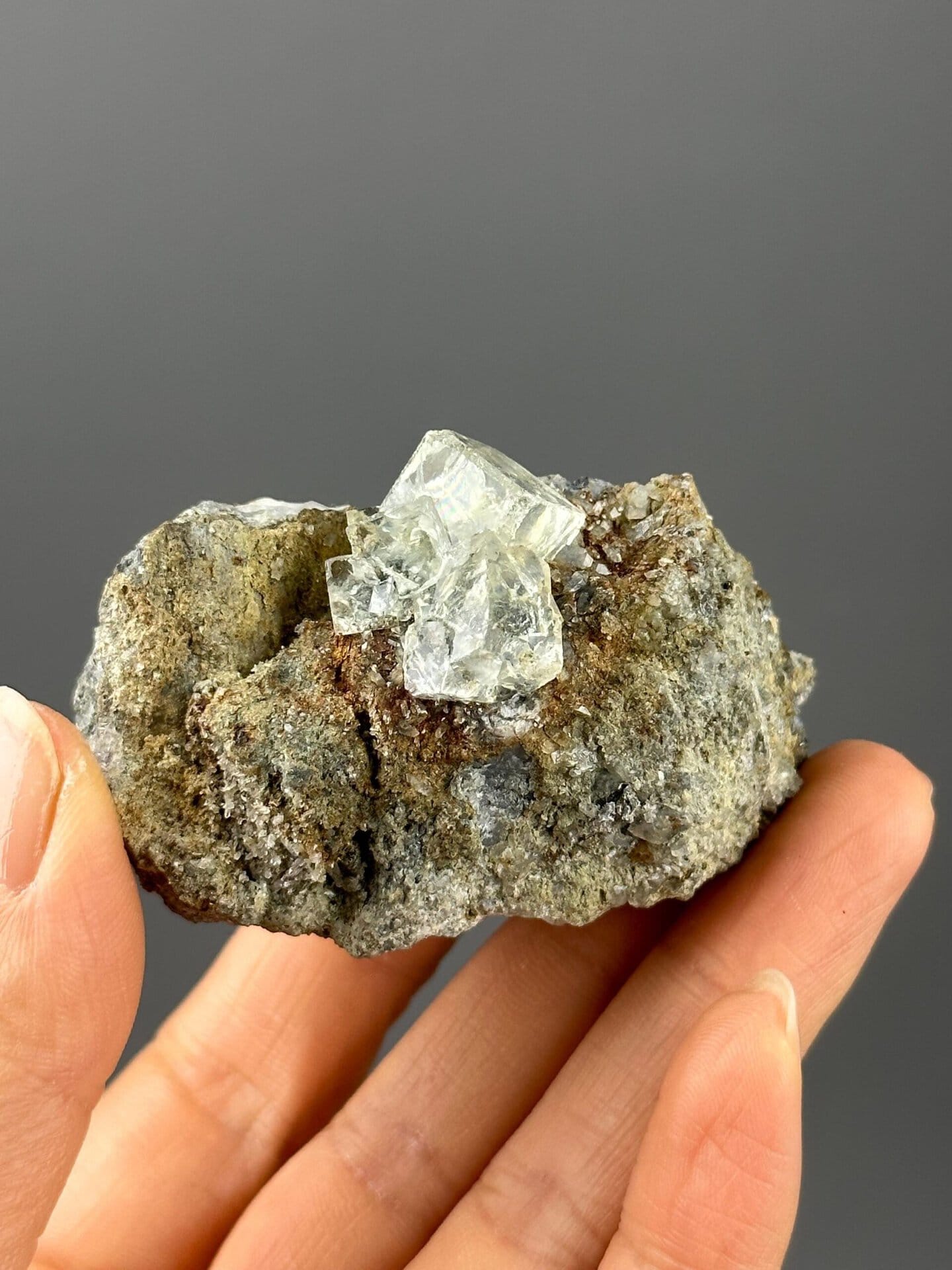 Front view of transparent green fluorite on matrix from Xianghualing