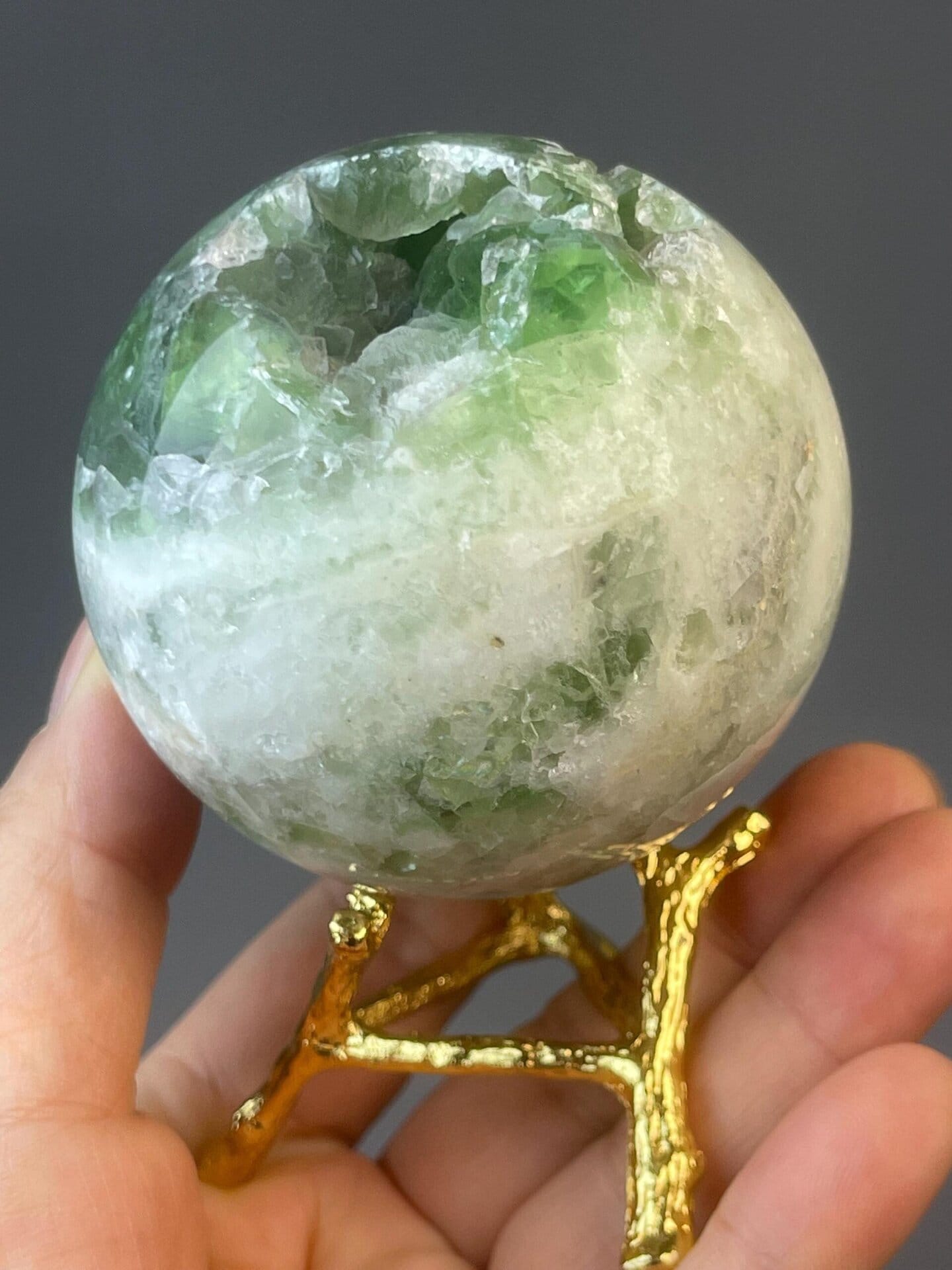 Collector carved green fluorite sphere specimen