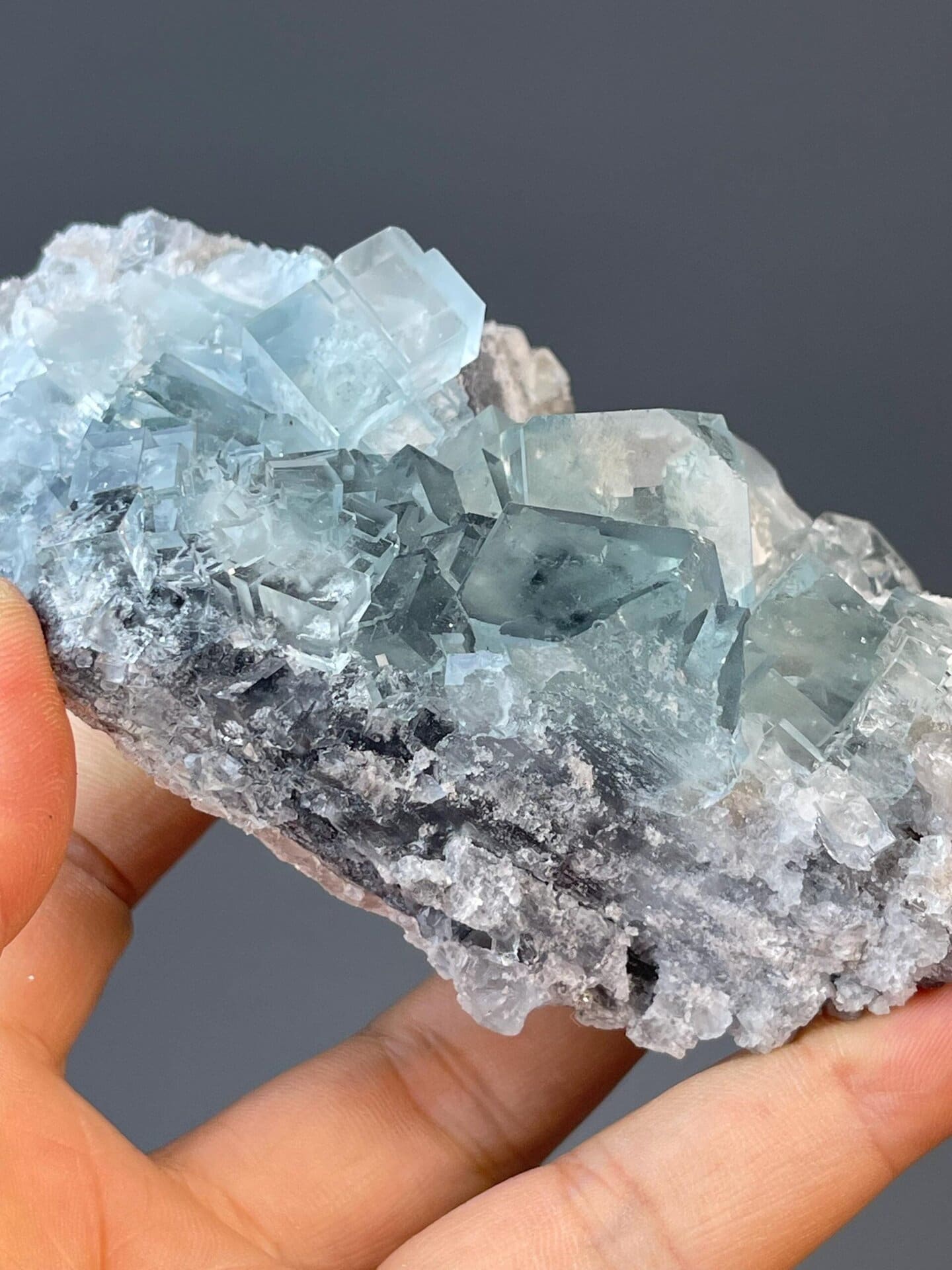 Zhejiang blue fluorite with hand-sized translucent cubic habit