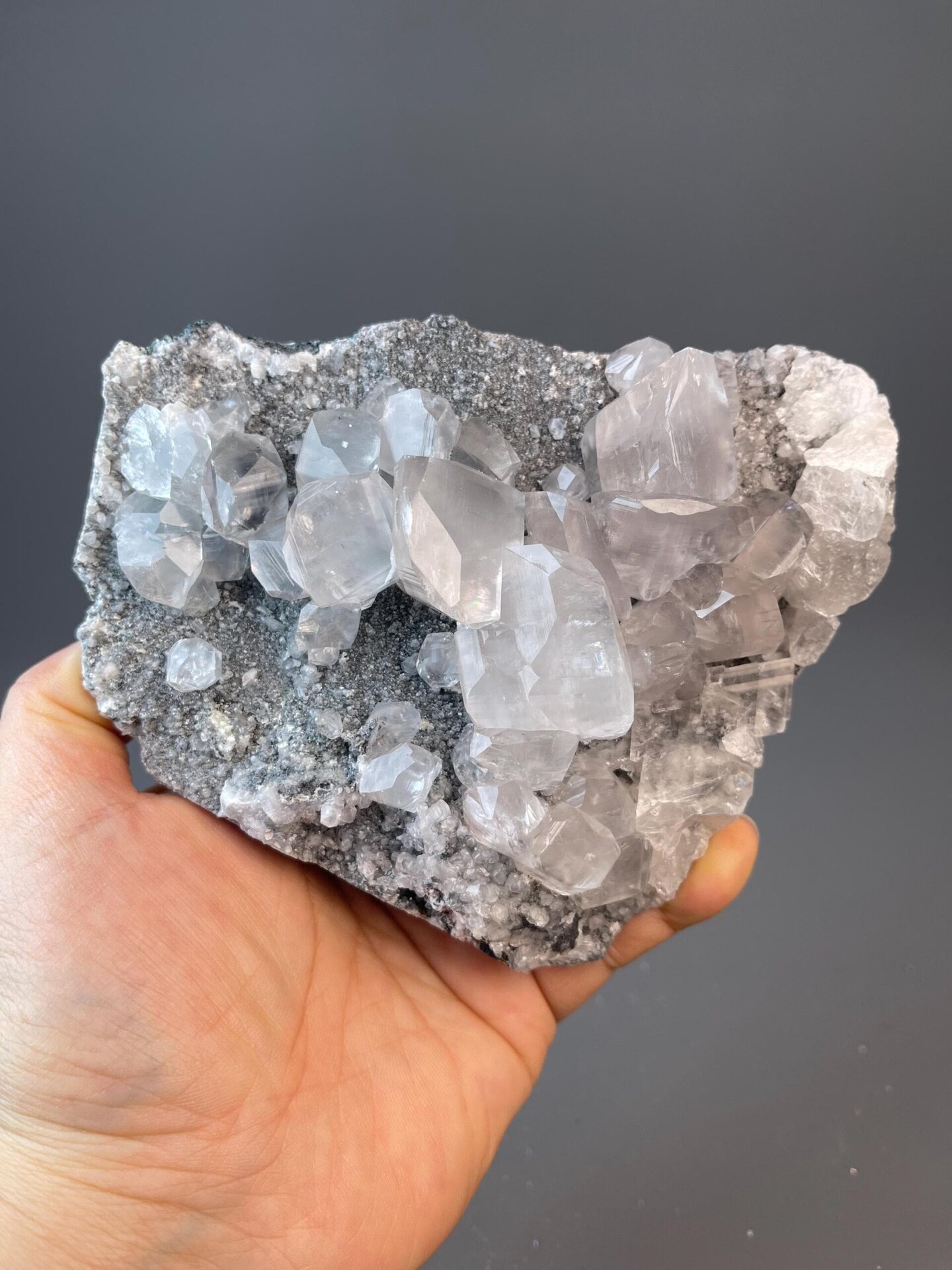 CaCO₃ trigonal calcite cluster with shimmering white crystals