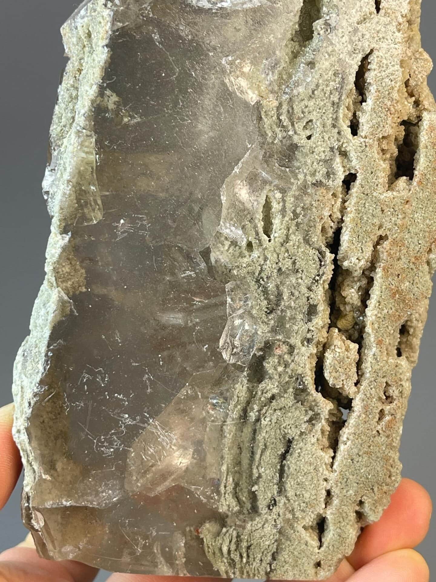 Calcite tower carving with natural banding and pointed top