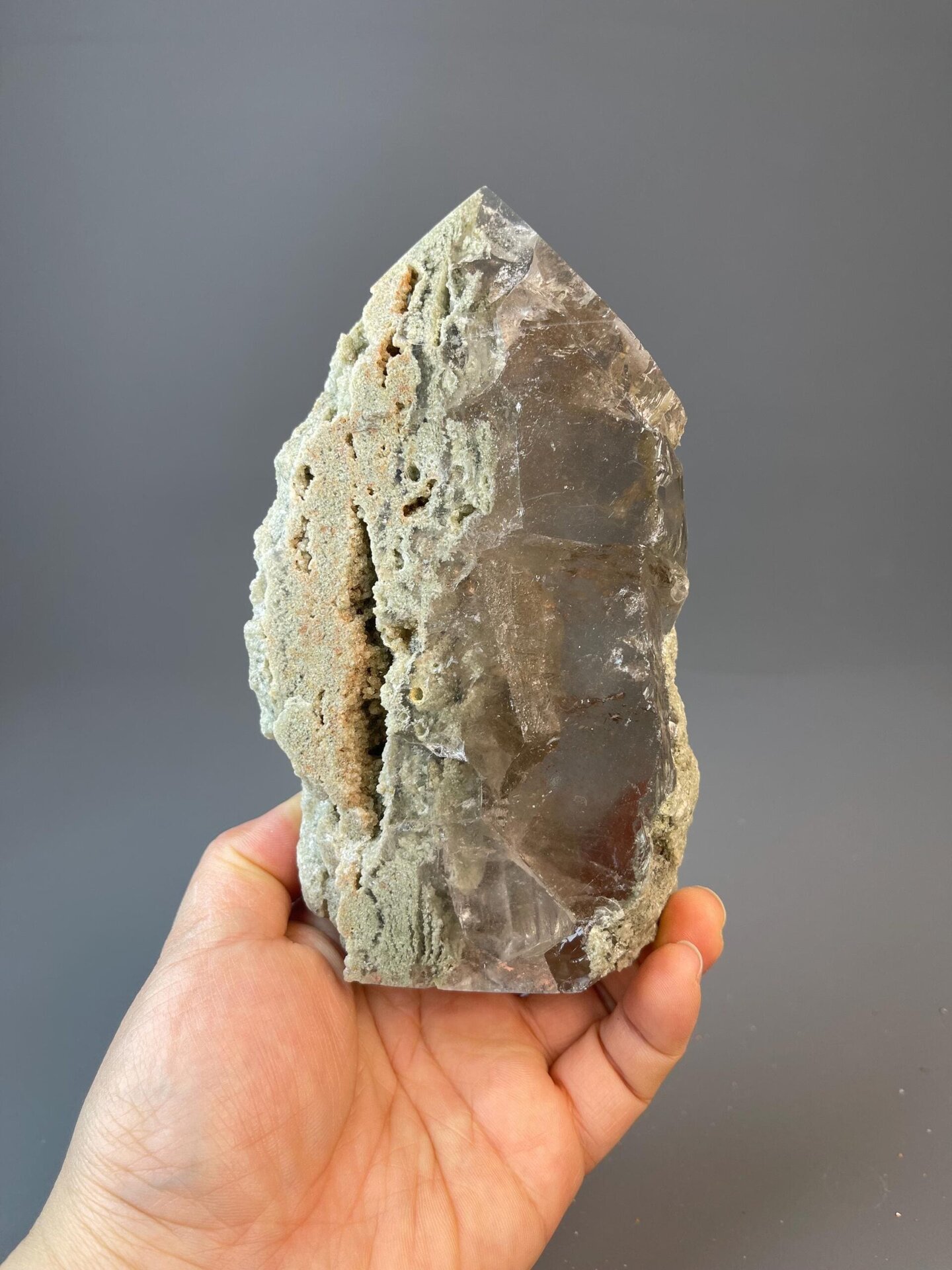 Carved calcite obelisk with natural color bands and patterns