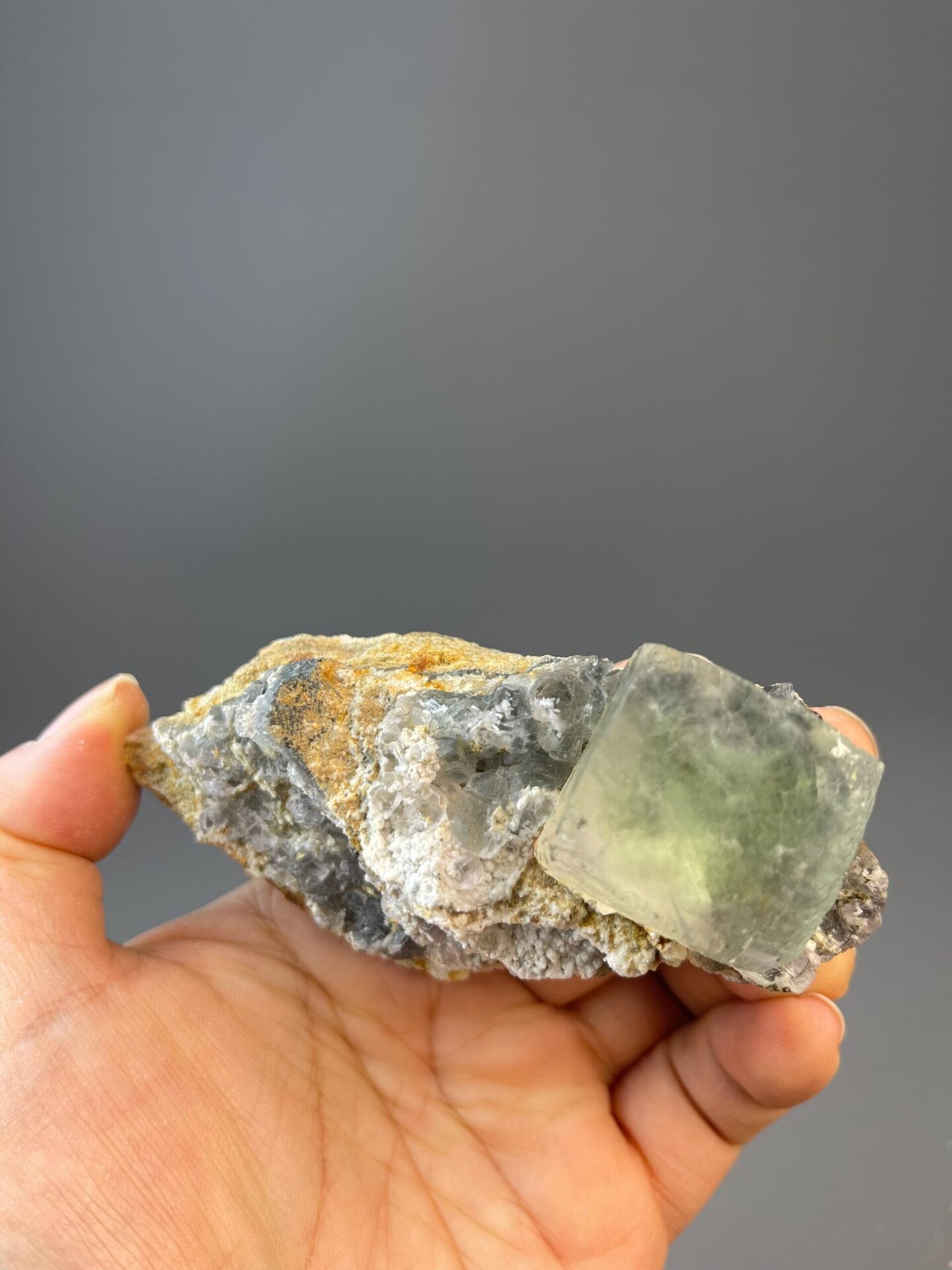 Green fluorite cubic crystal measuring 4.0×1.8×1.5 inches