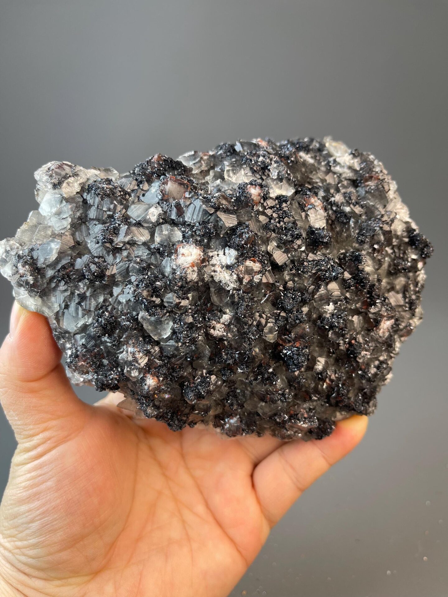 Fe₂O₃ trigonal hematite with secondary red layer and calcite