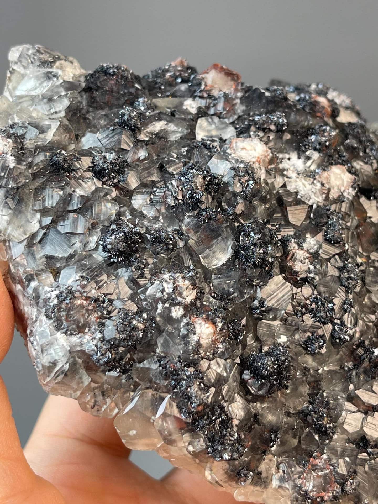 Hematite with secondary red iron coating and calcite crystals