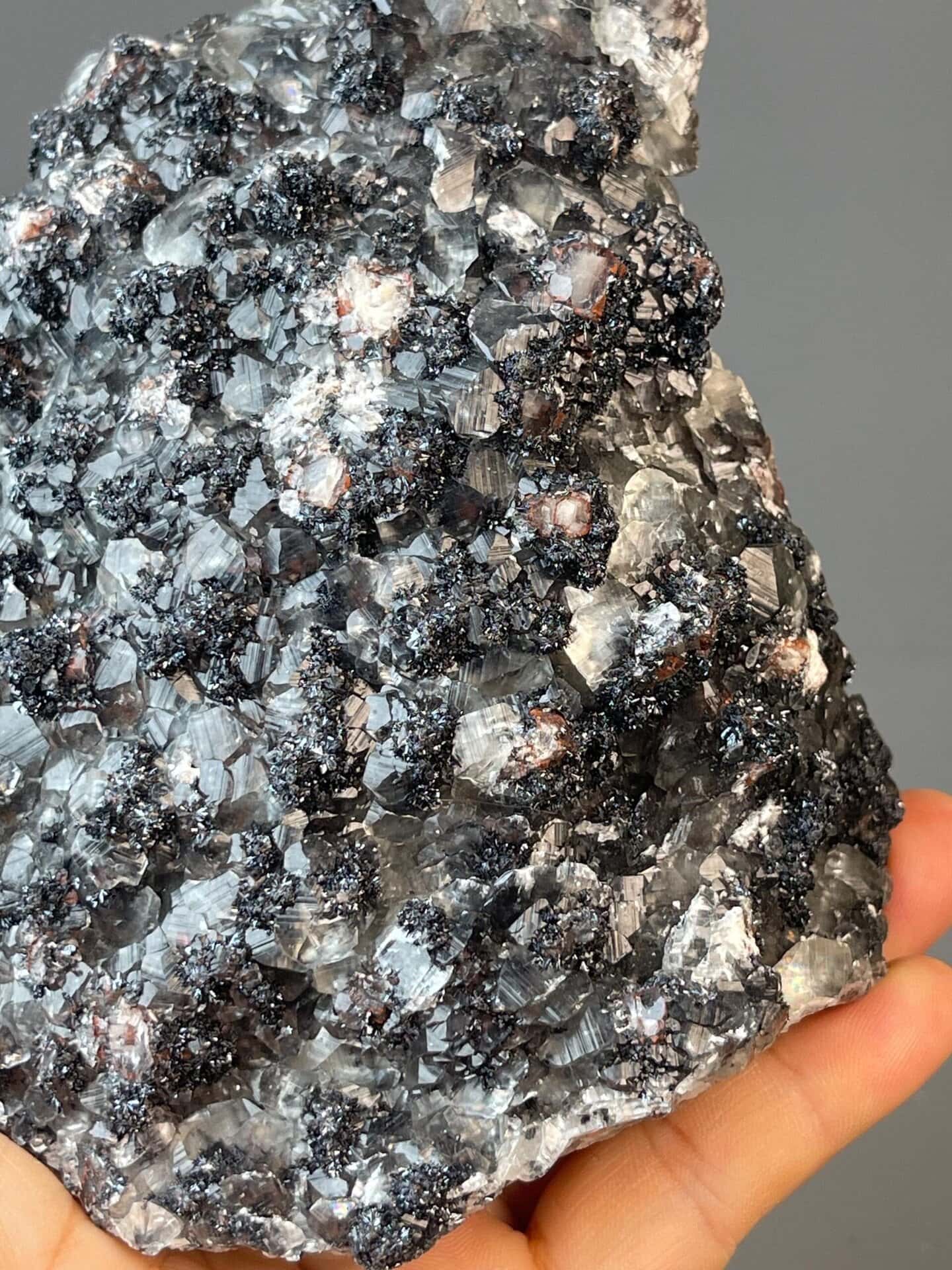 Collector hematite and calcite cluster with metallic luster