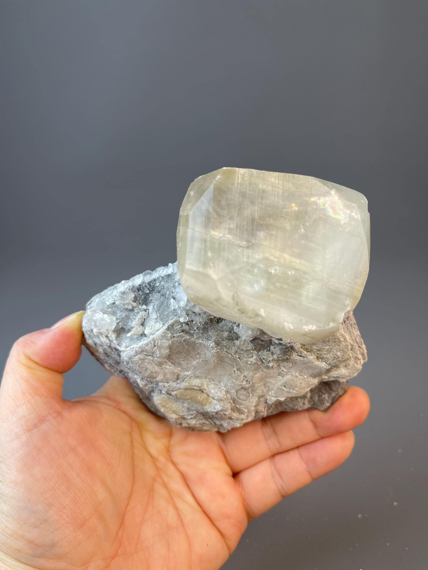Yellow calcite sphere with radiating crystal blades on matrix