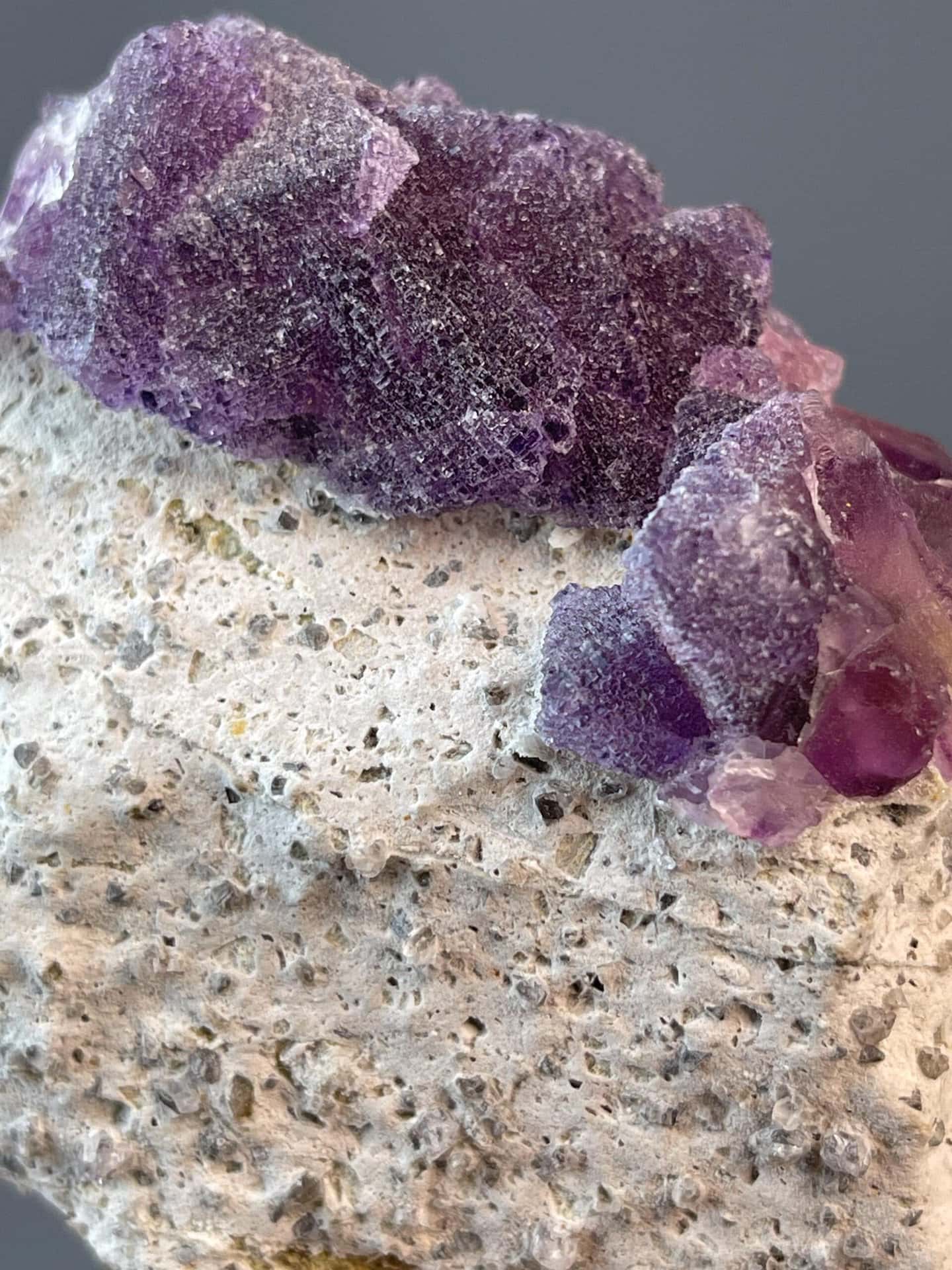 Purple fluorite octahedra forming rugged mountain-like cluster