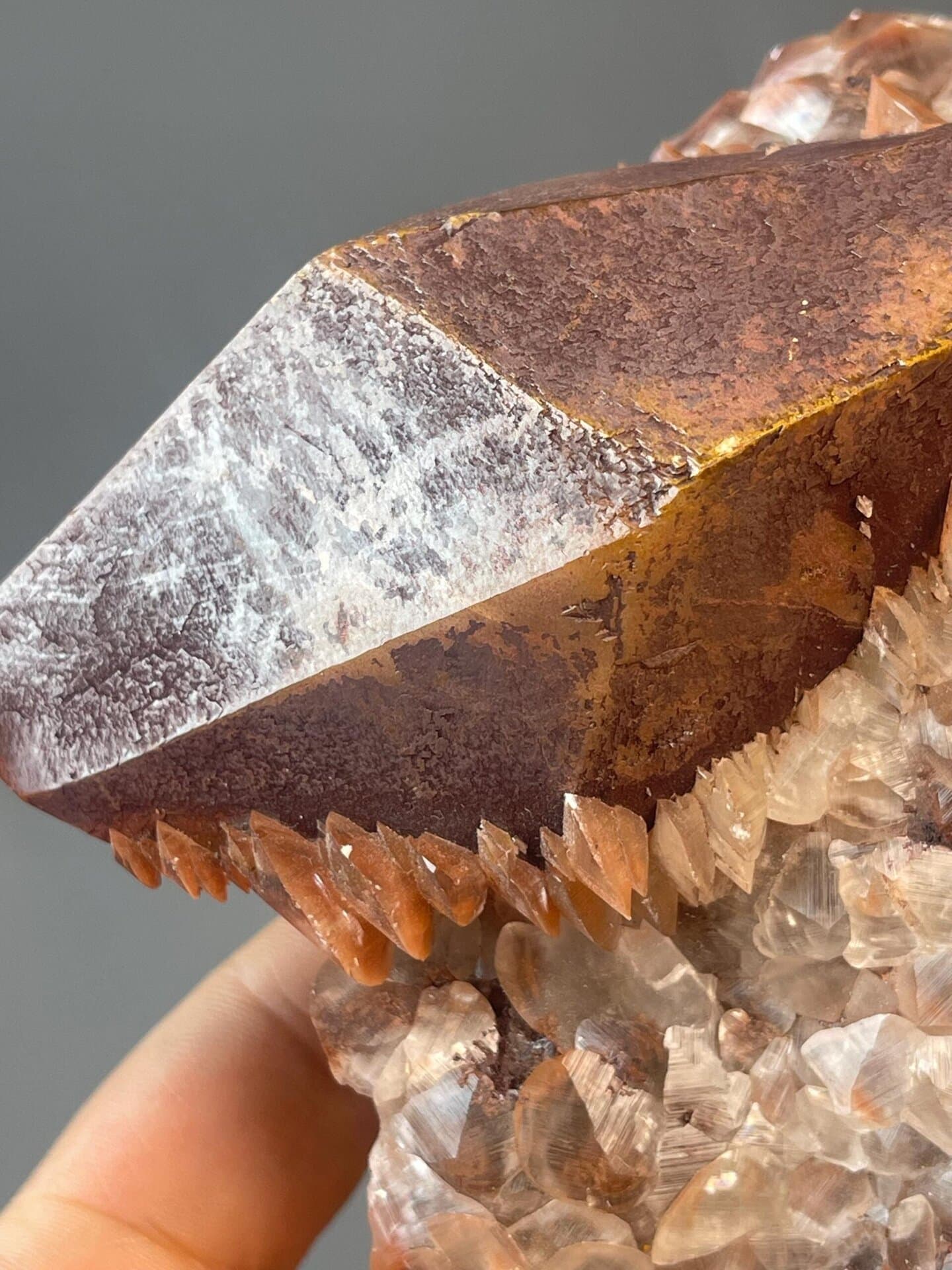 Red octahedral calcite, 18.52 oz, vitreous luster