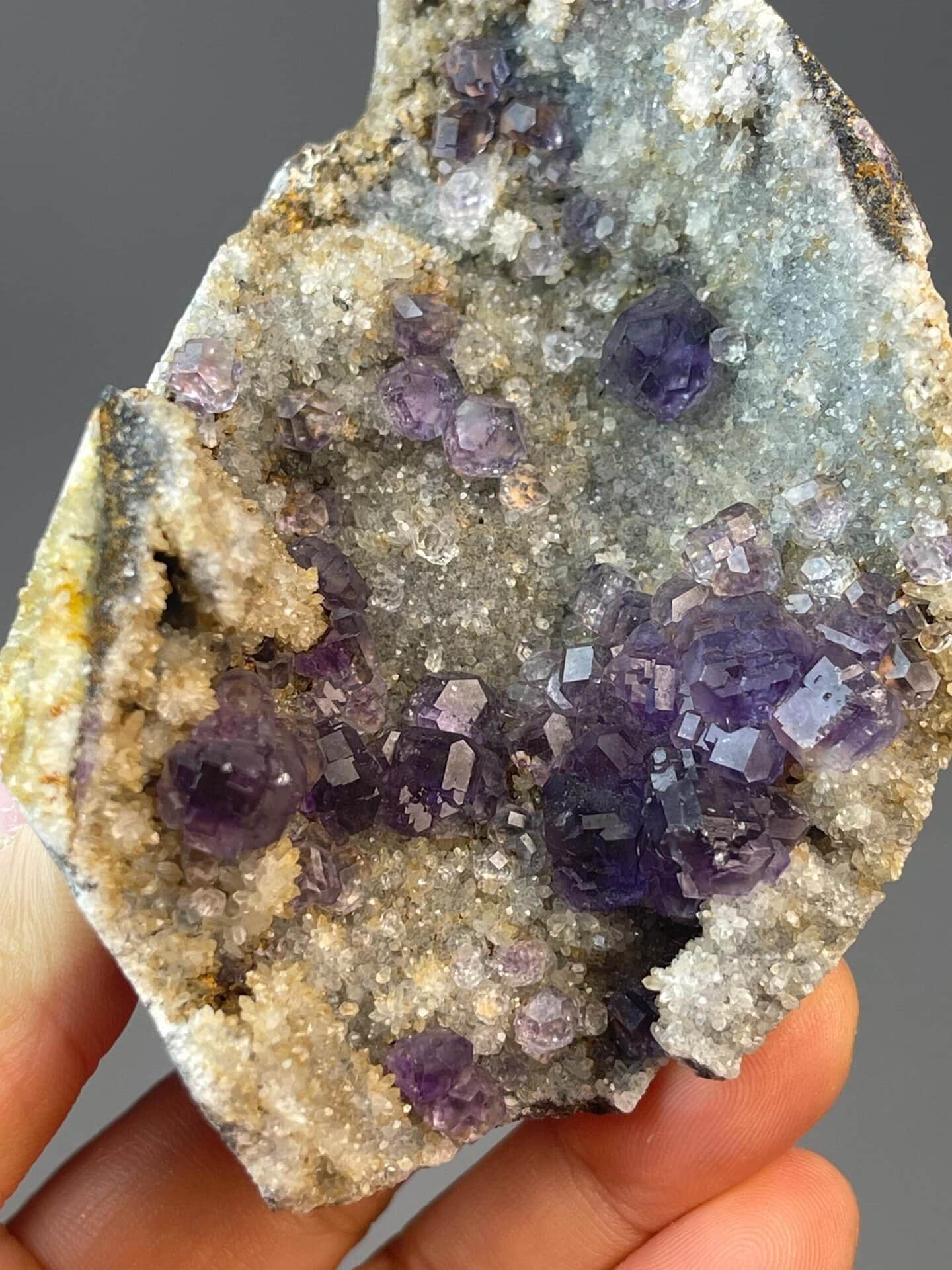 Deep purple CaF₂ tanzan fluorite on white quartz matrix