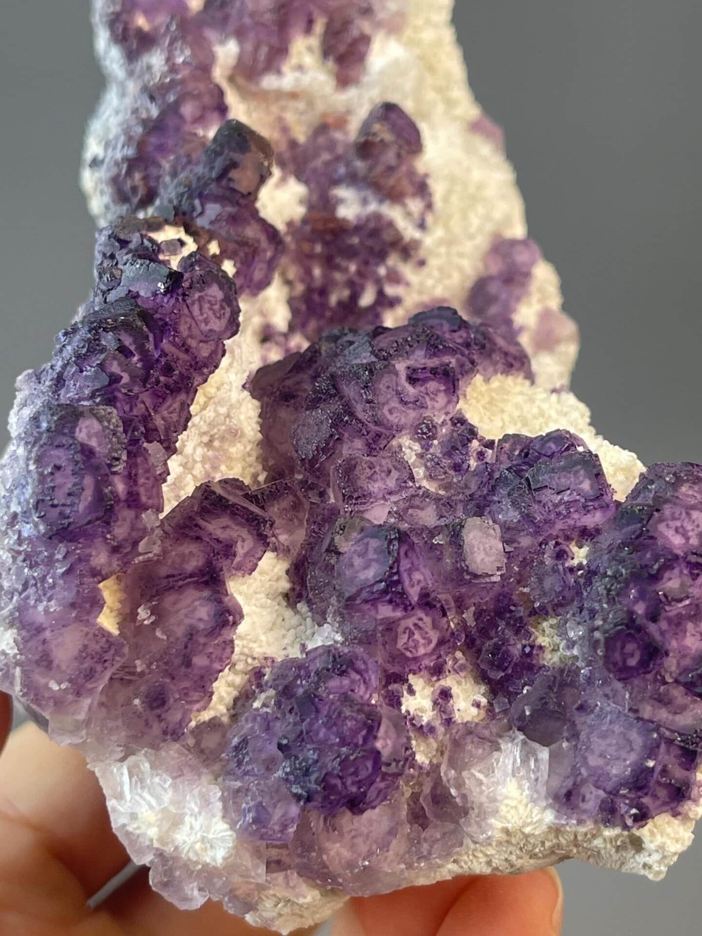 CaF₂ isometric purple fluorite arranged in fan-shaped formation