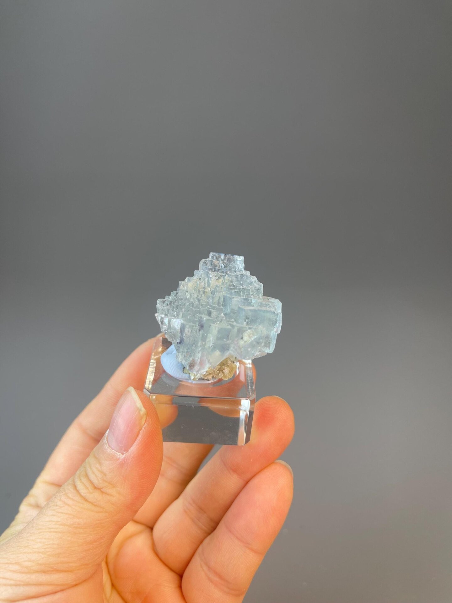 Sky blue stepped cube fluorite with phantom on dolomite matrix