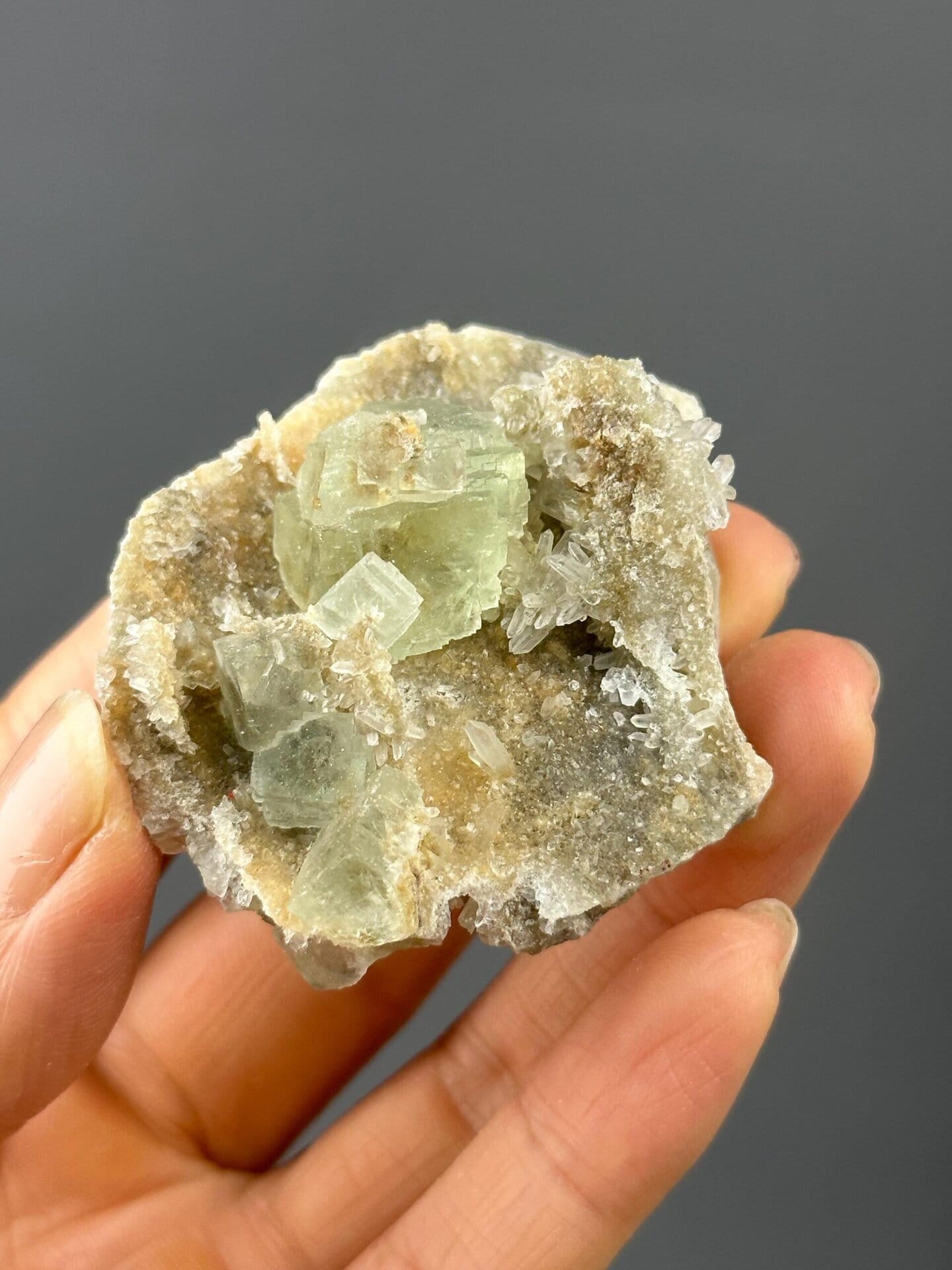 Back view of Xianghualing green fluorite on quartz