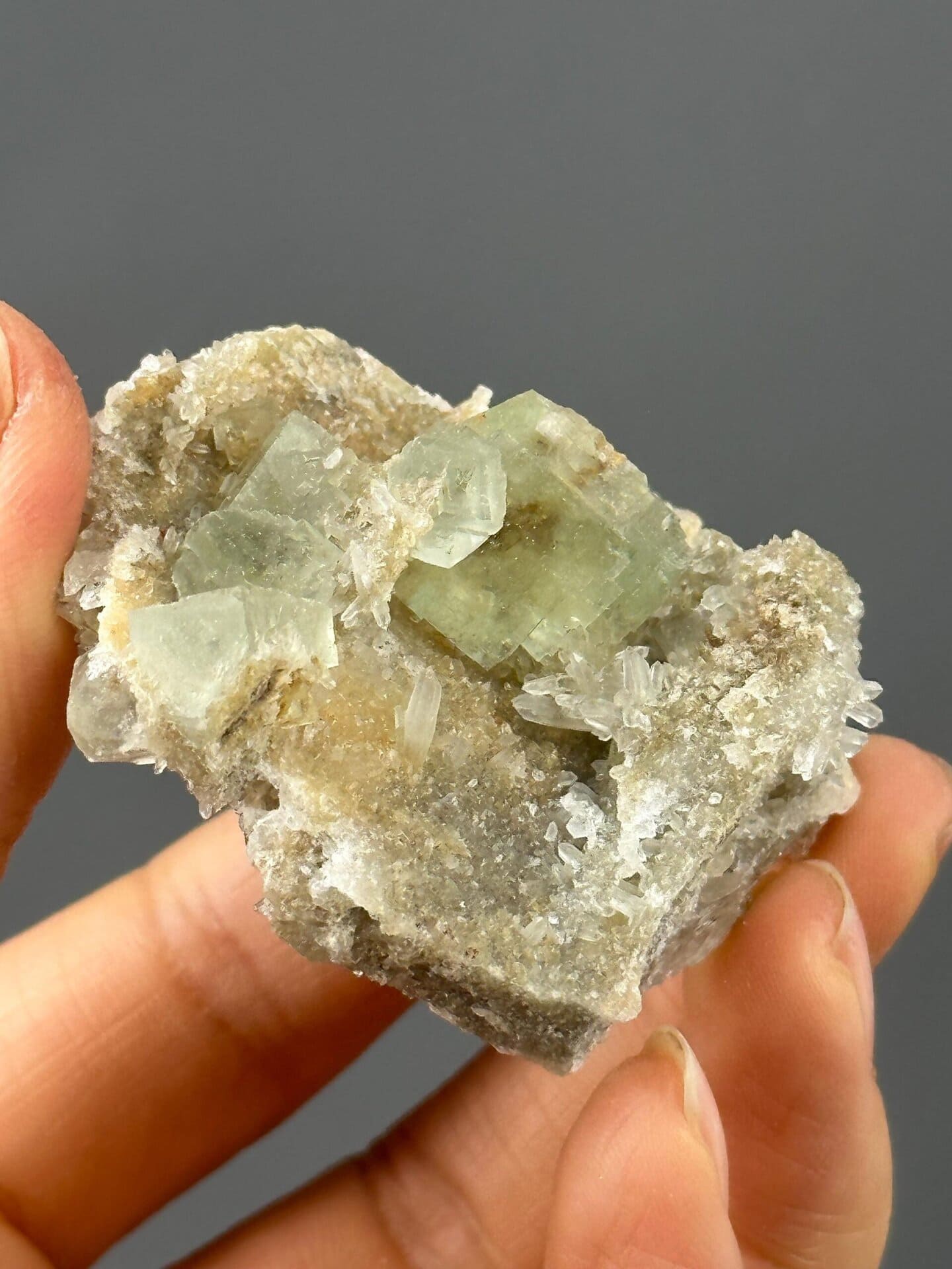 Angled view of green fluorite with quartz matrix