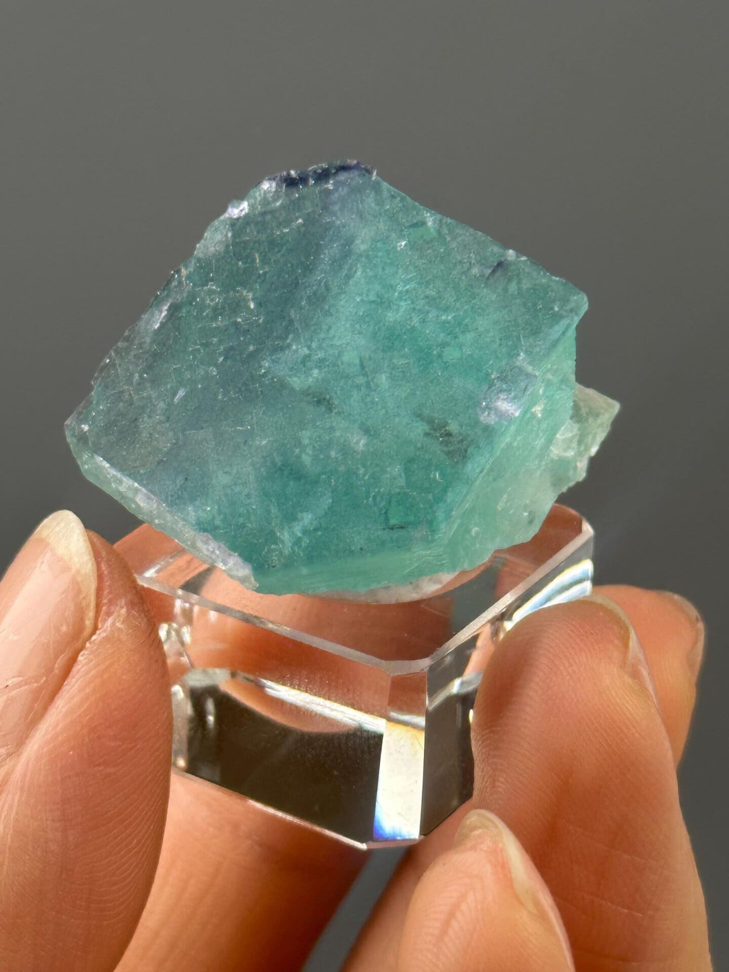 Front view of turquoise fluorite showing step growth pattern