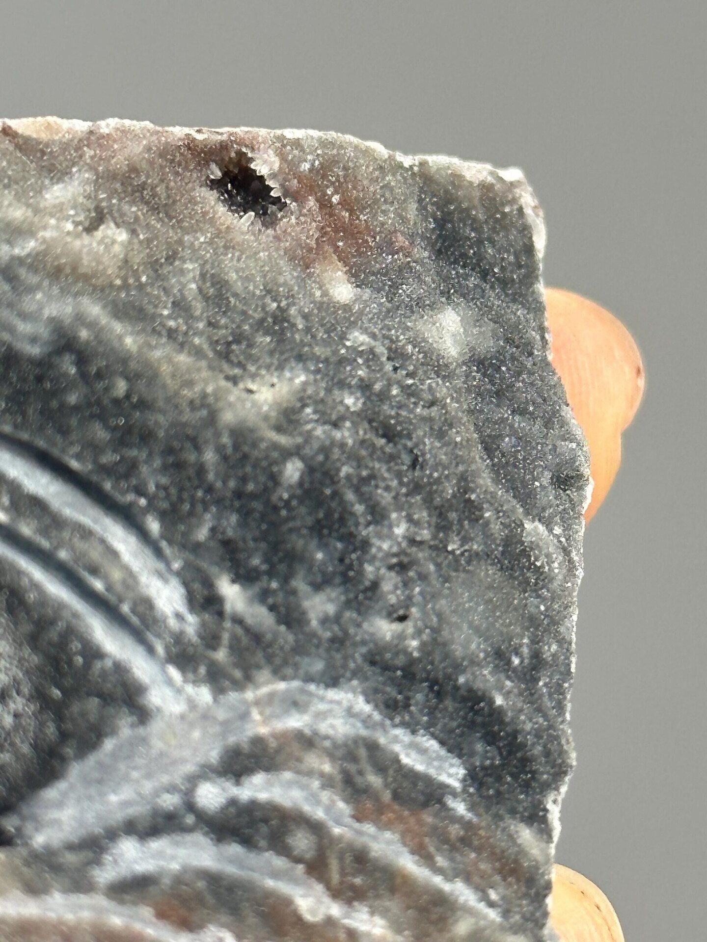 Angled view of agate and zinc ore pyramid sculpture