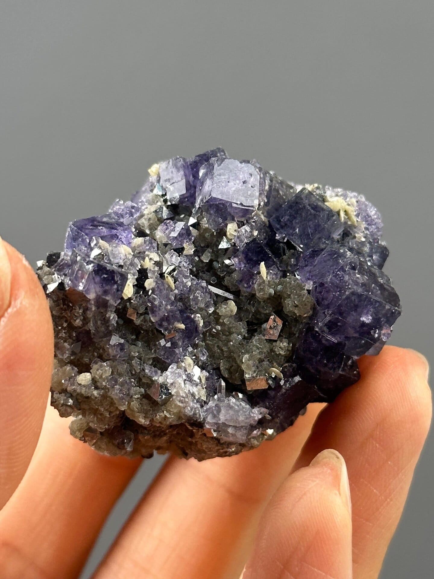 Front view of purple phantom fluorite on dolomite matrix