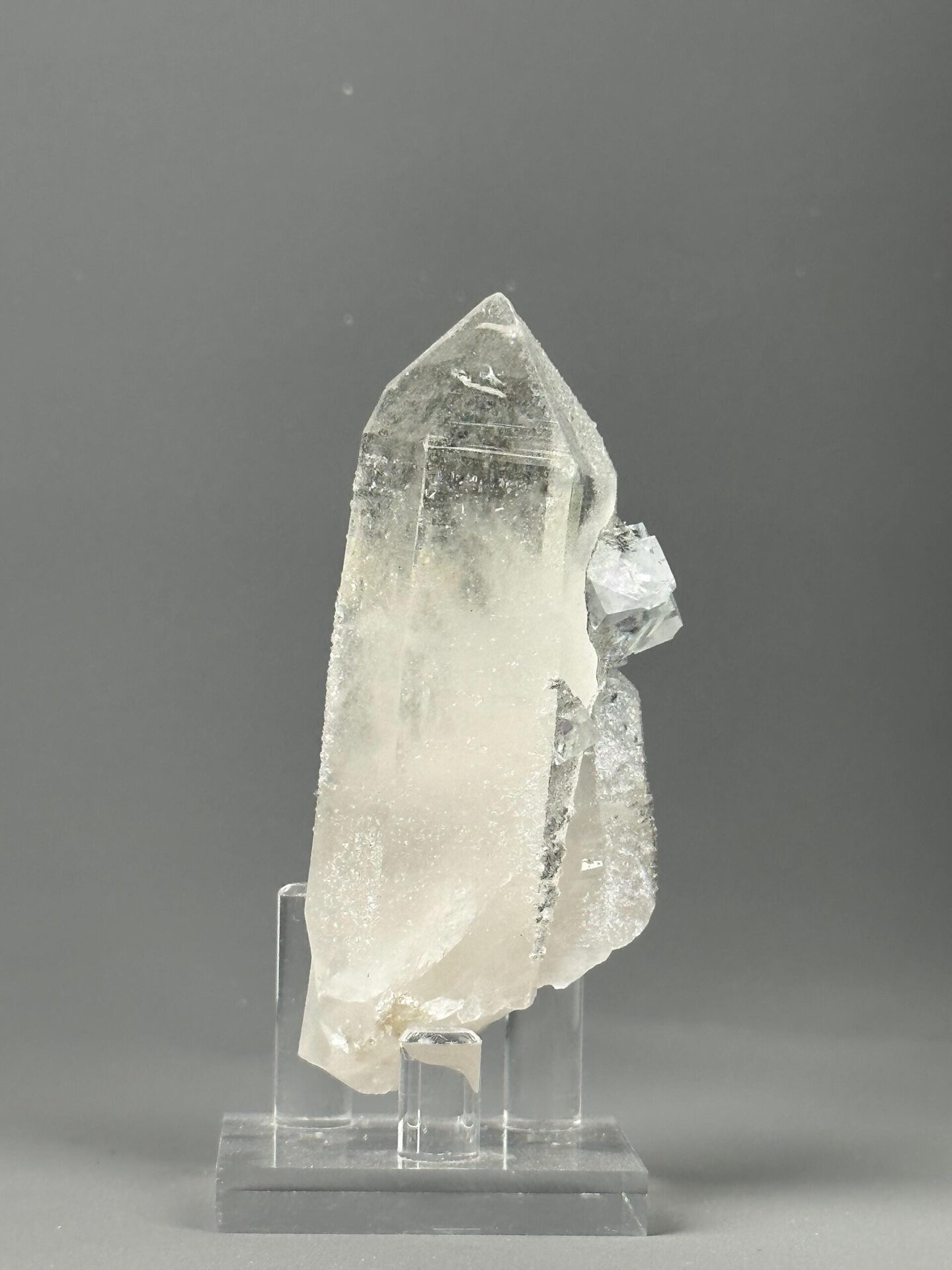 Side view of raw fluorite showing natural matrix