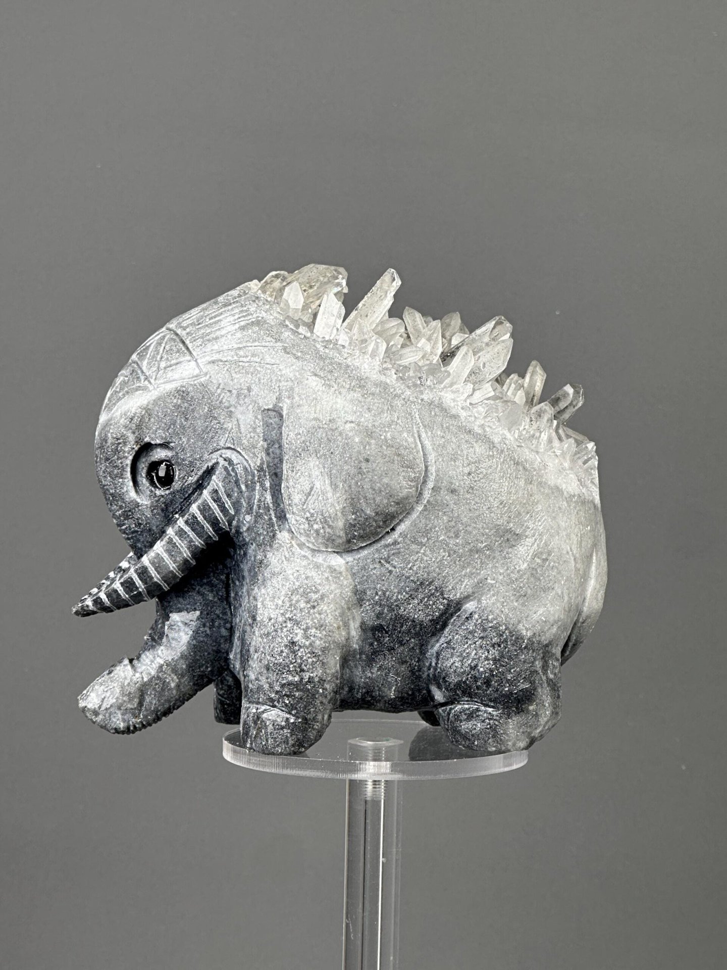 Hand-carved crystal elephant sculpture from natural raw mineral matrix, China