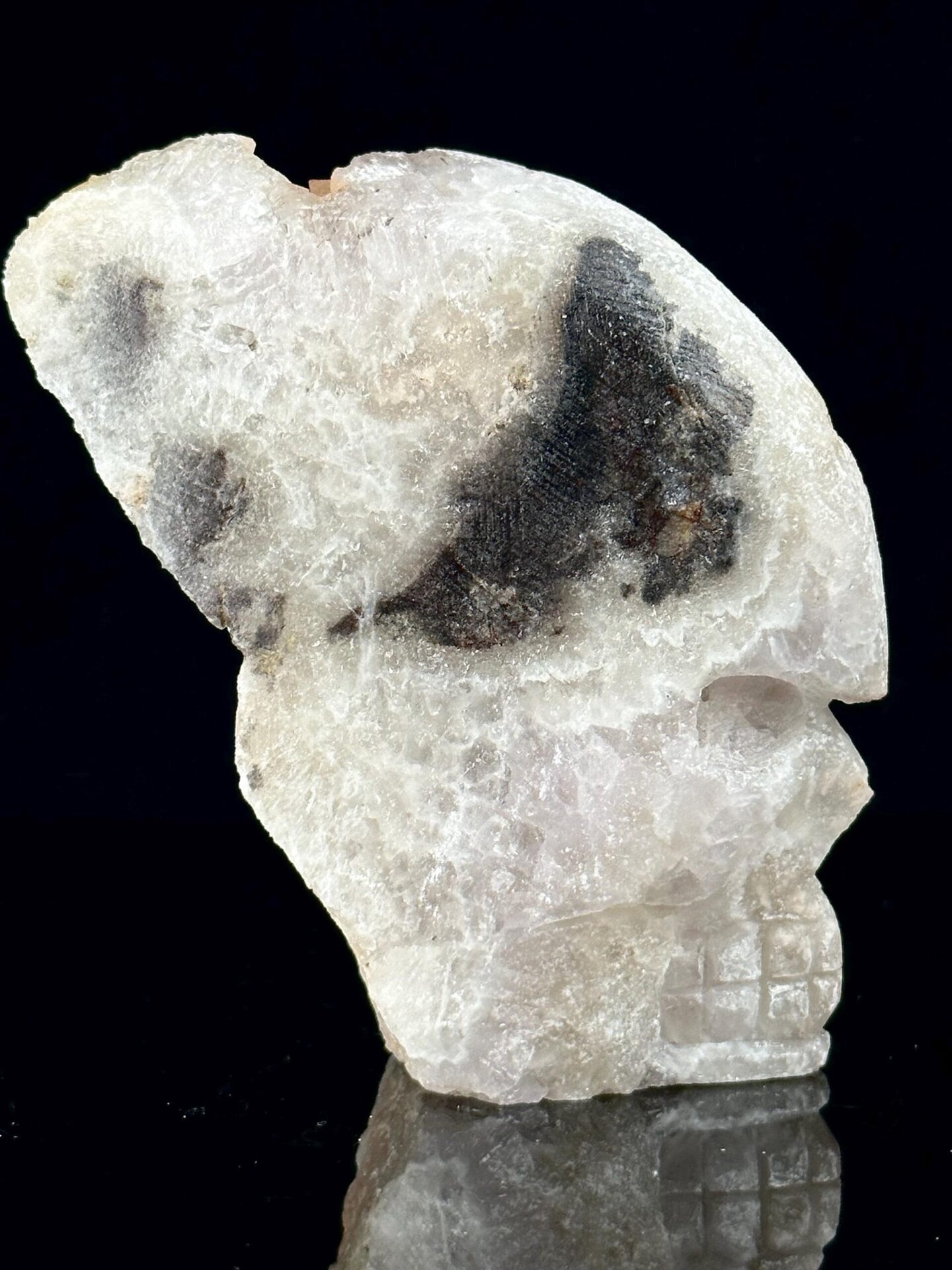 Side profile of quartz crystal skull, 3×1.9×2.4 in