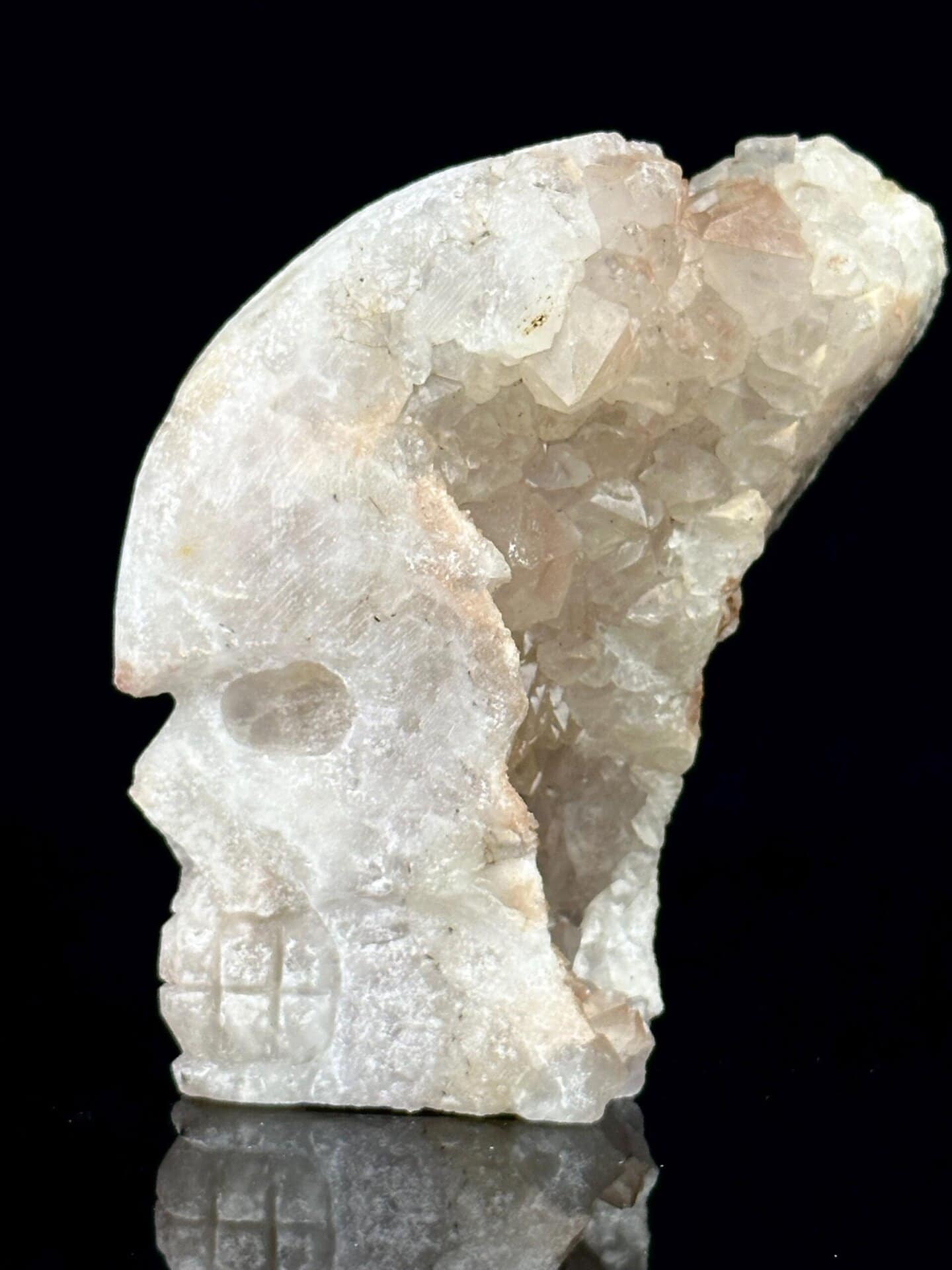 Detail of druzy quartz crystals inside carved skull