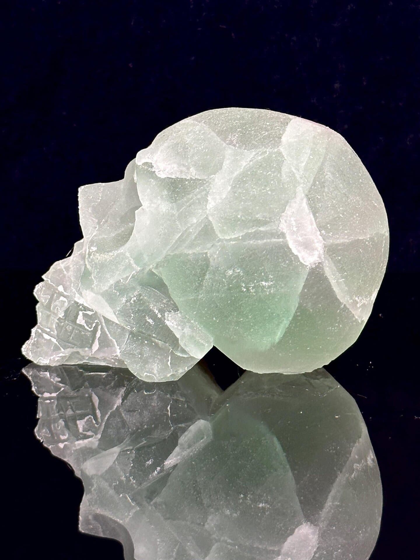 Angled view of large green fluorite skull with crystal interior