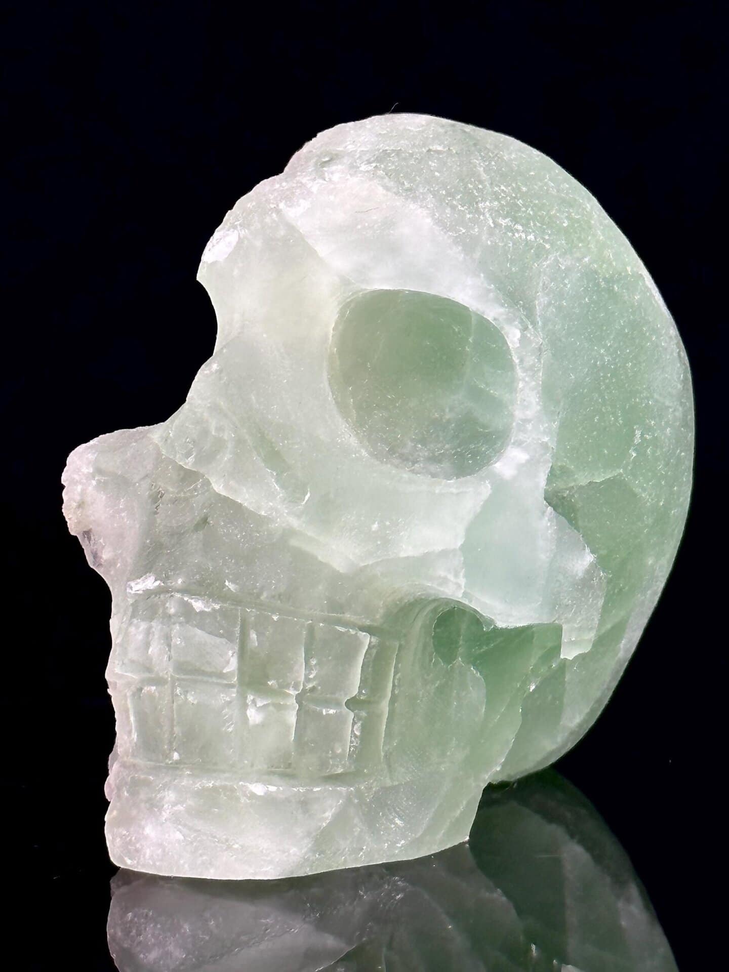 Back view of hand-carved green fluorite skull geode