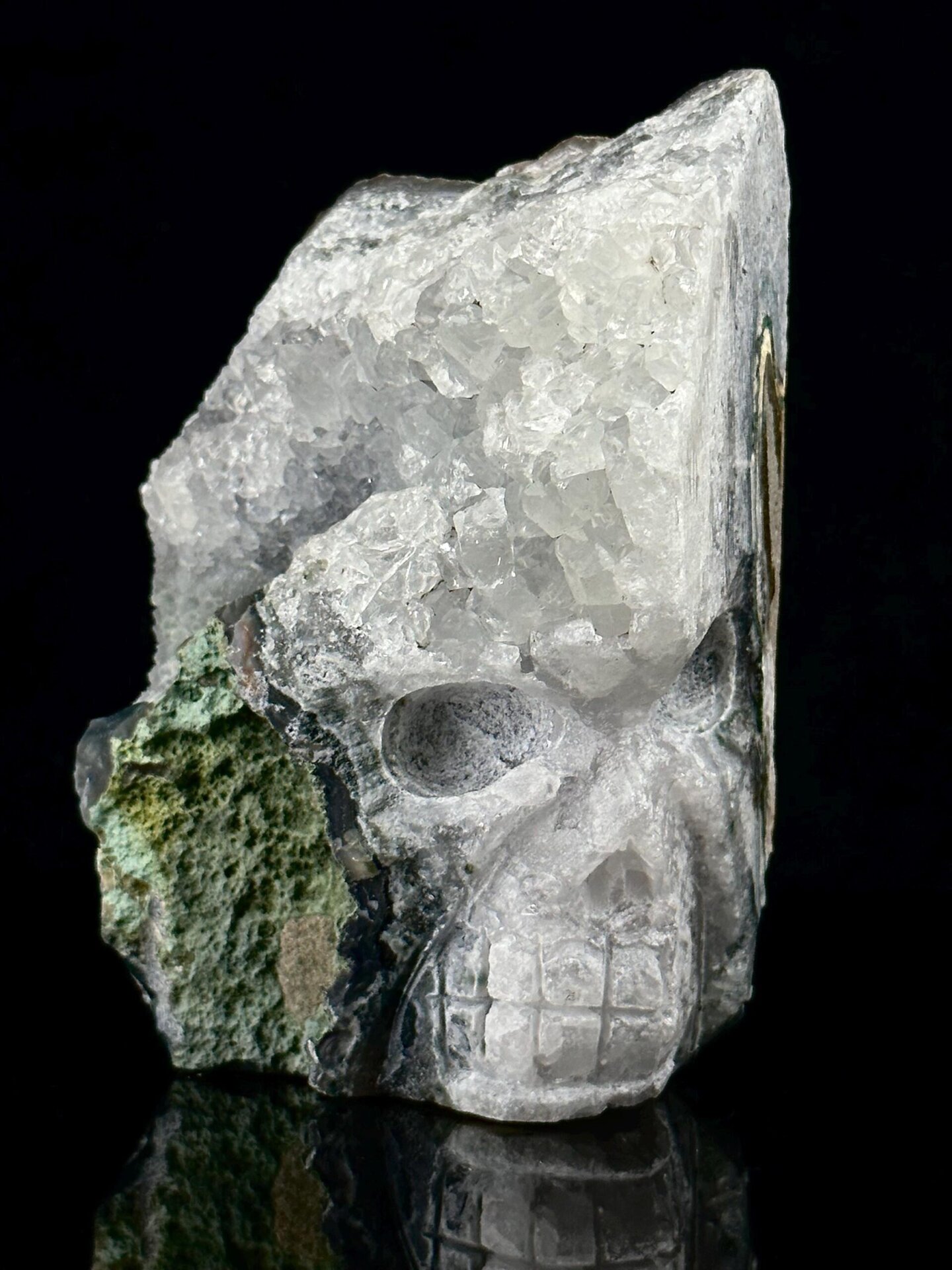 Close-up of malachite inlay on quartz geode skull