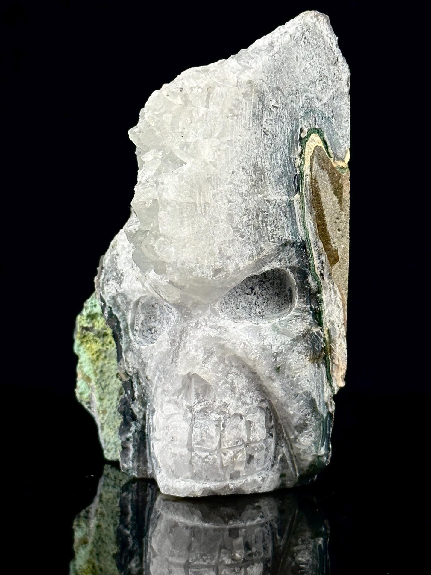 Top view of hand-carved quartz skull showing druzy crystal interior