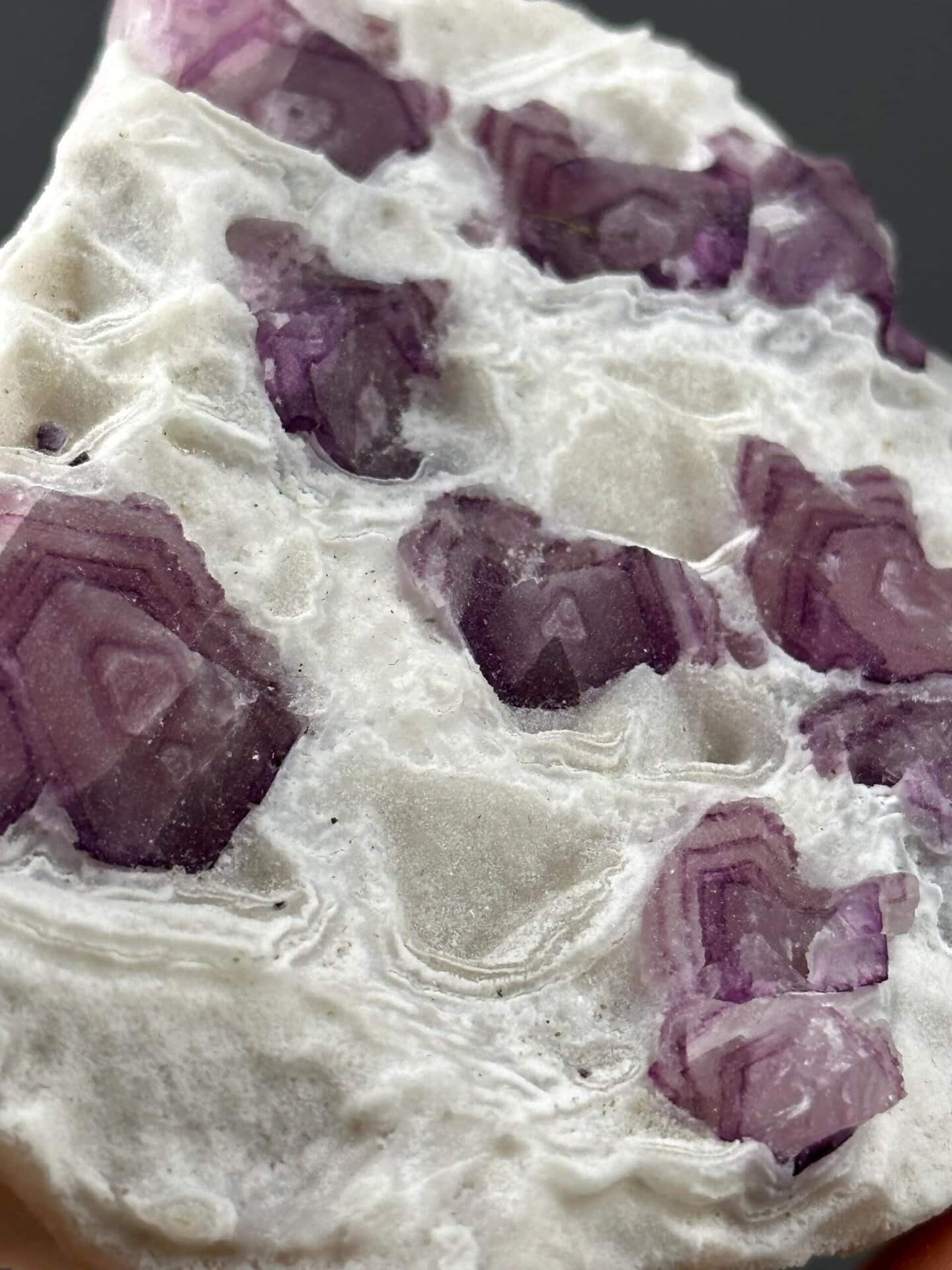 Detail of purple and clear banding in lollipop fluorite