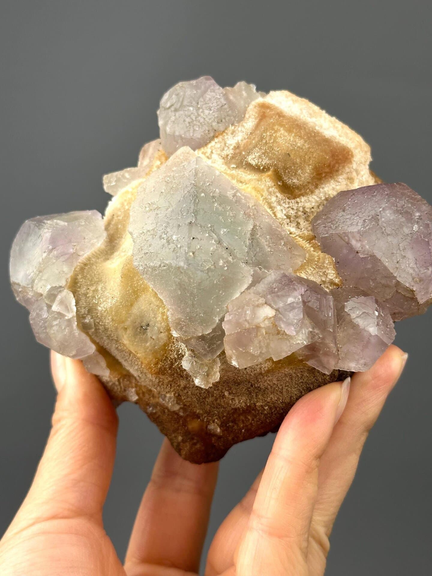 Front view of fluorite cluster showing phantom growth zones