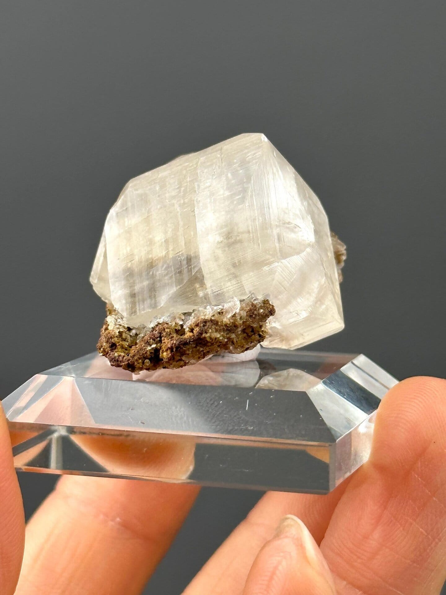 Side view of calcite on matrix, 1.5×1×1 in, Hunan