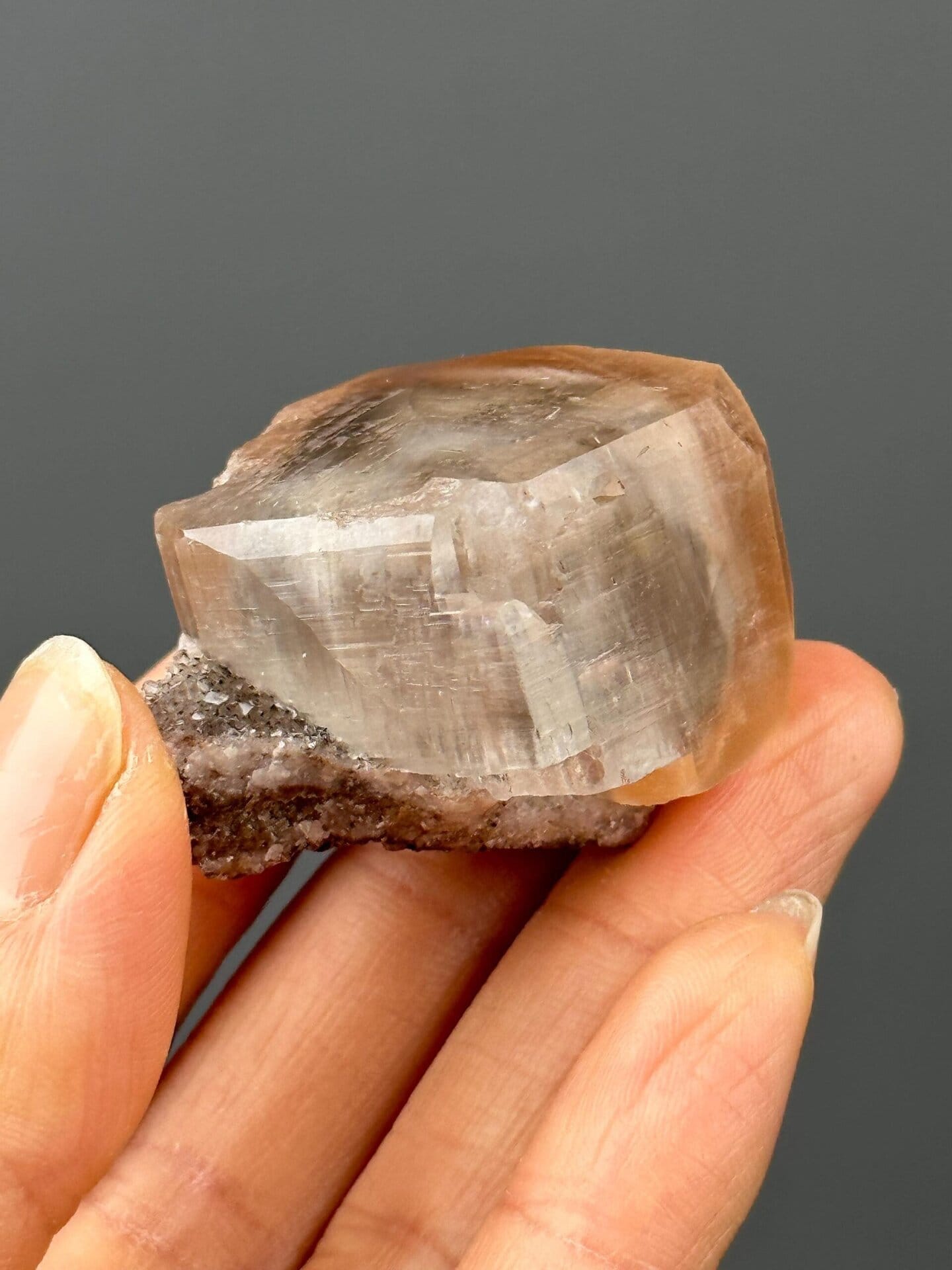 Angled view of lustrous calcite crystal matrix