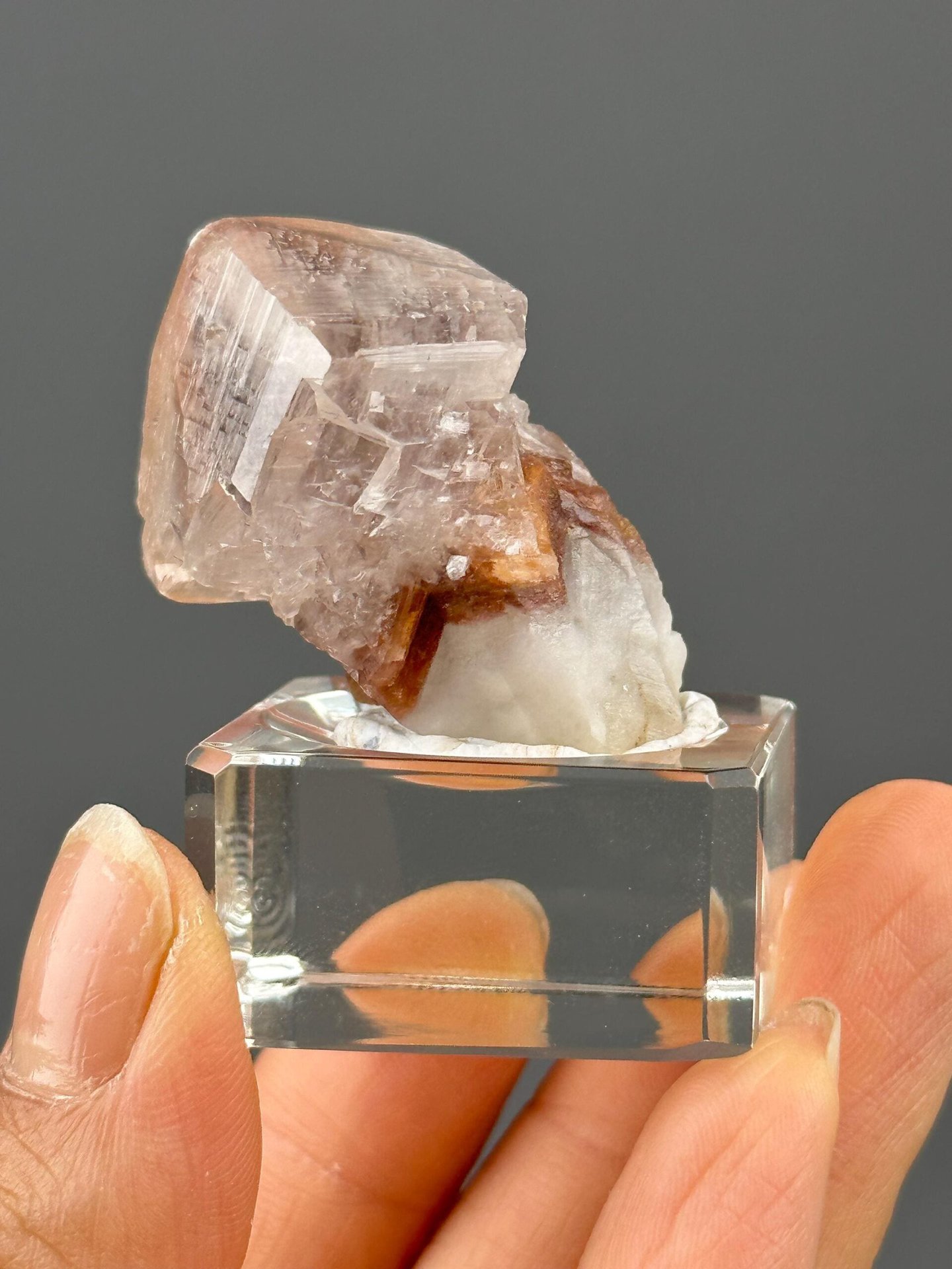 Close-up of red hematite inclusions within calcite crystal