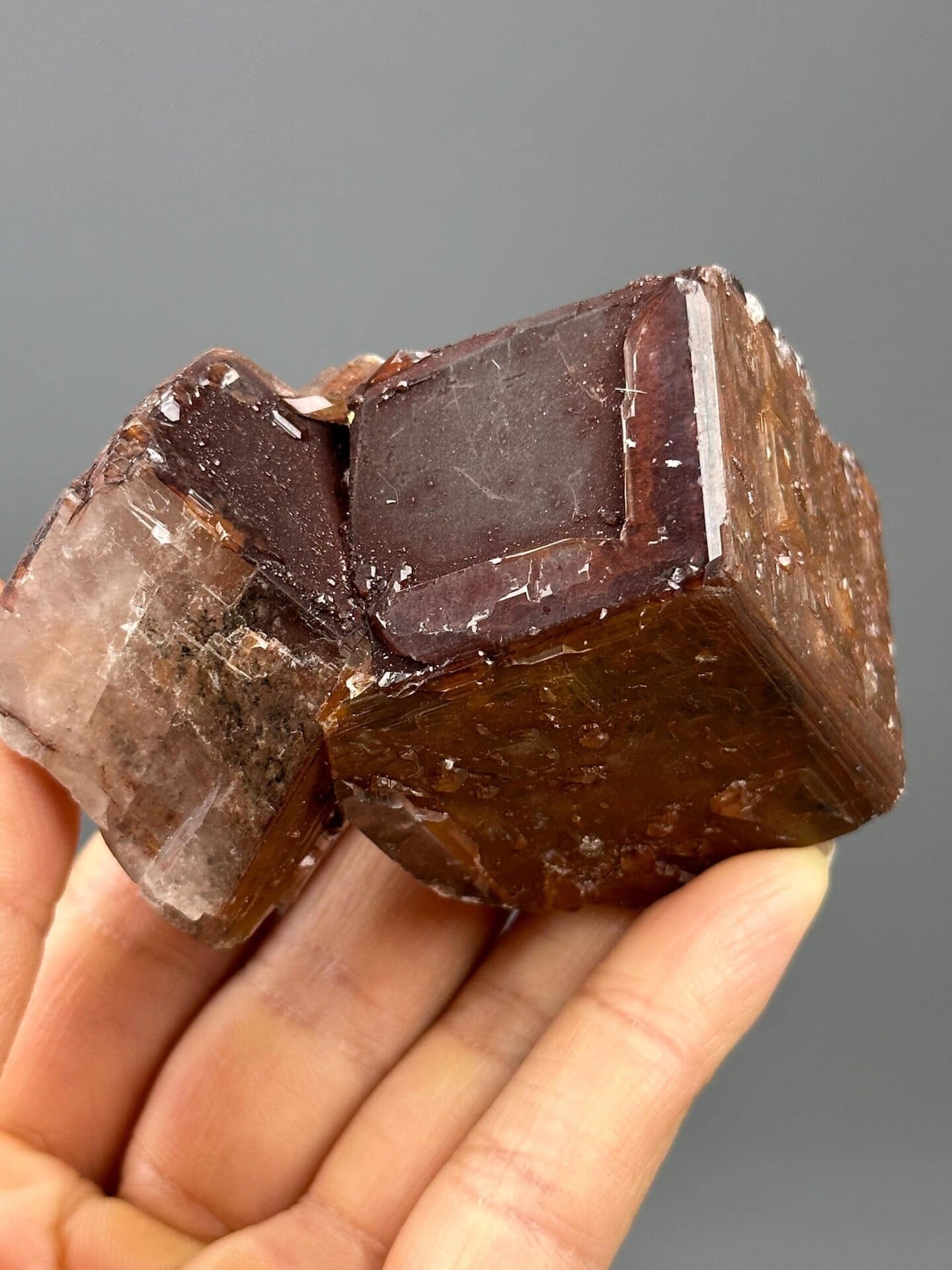 Deep brown twinned calcite with natural etched surfaces from Hunan, China