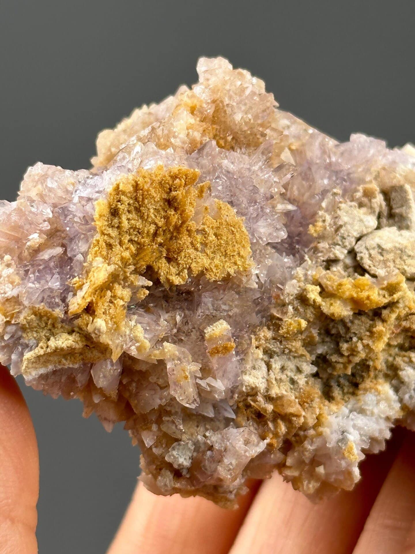 Close-up of translucent purple gypsum crystals showing pearly luster