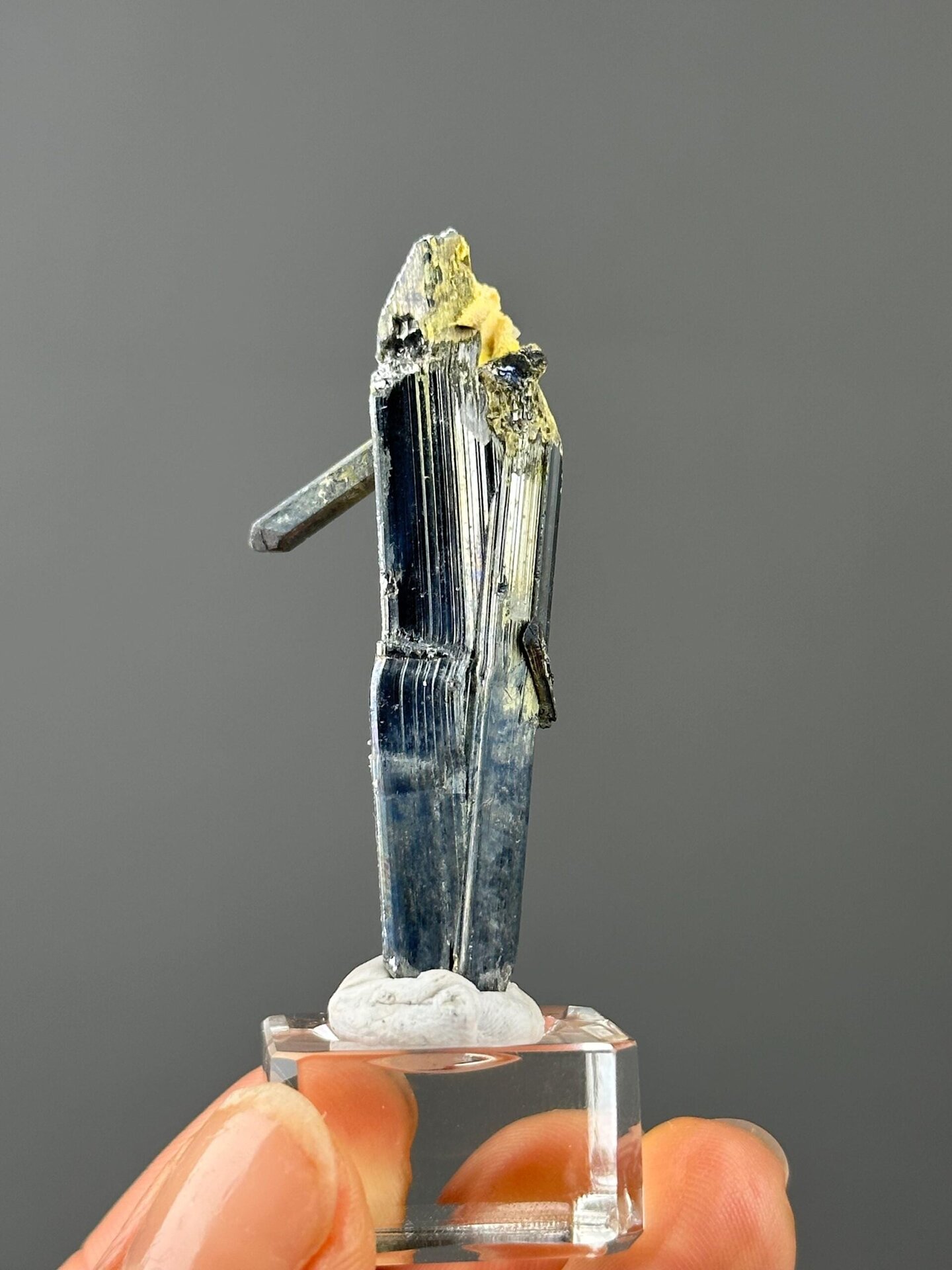 Side view of stibnite crystal, 2×0.9×0.4 in, Hunan