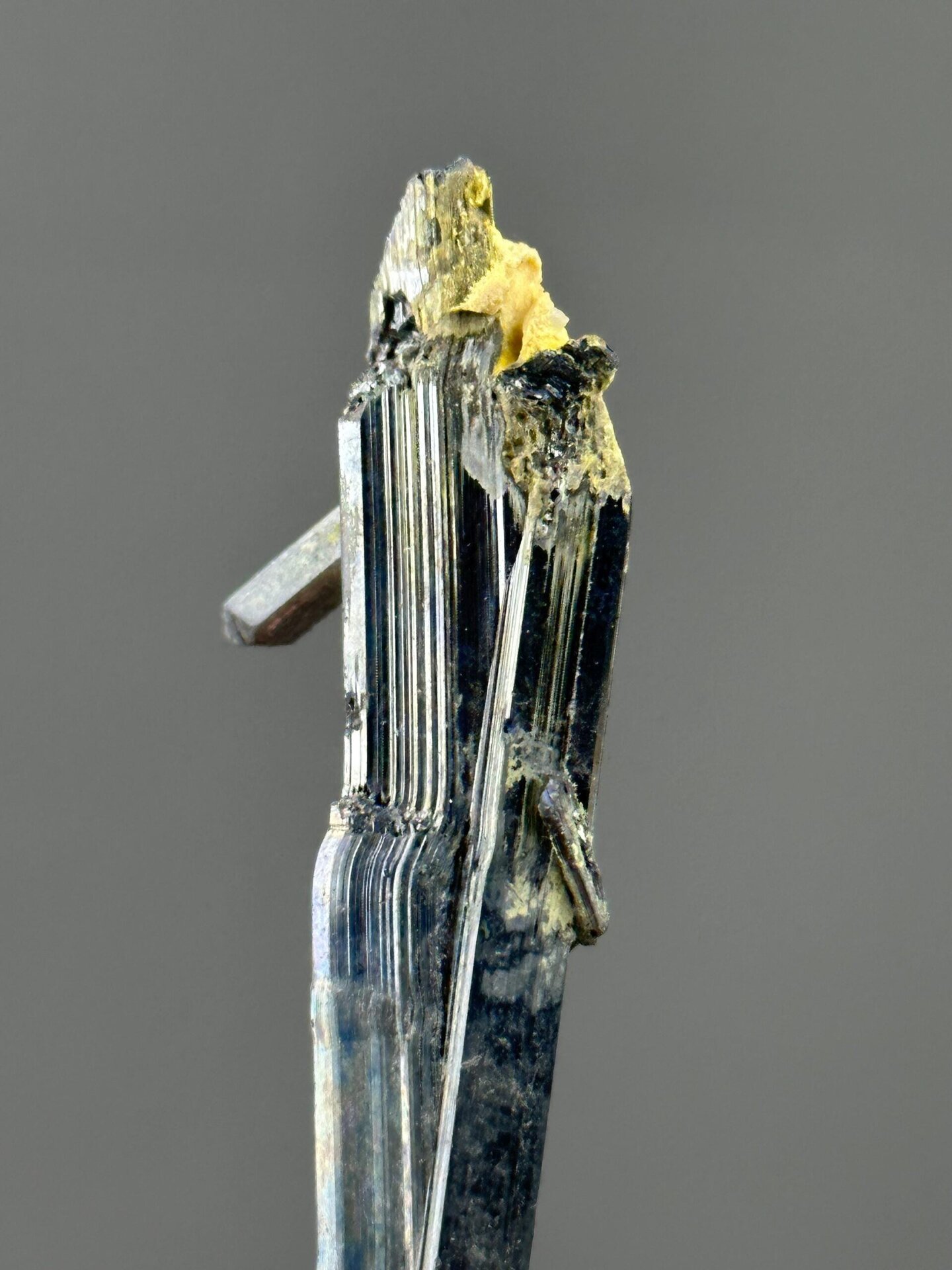 Top view of stibnite column showing reflective surface