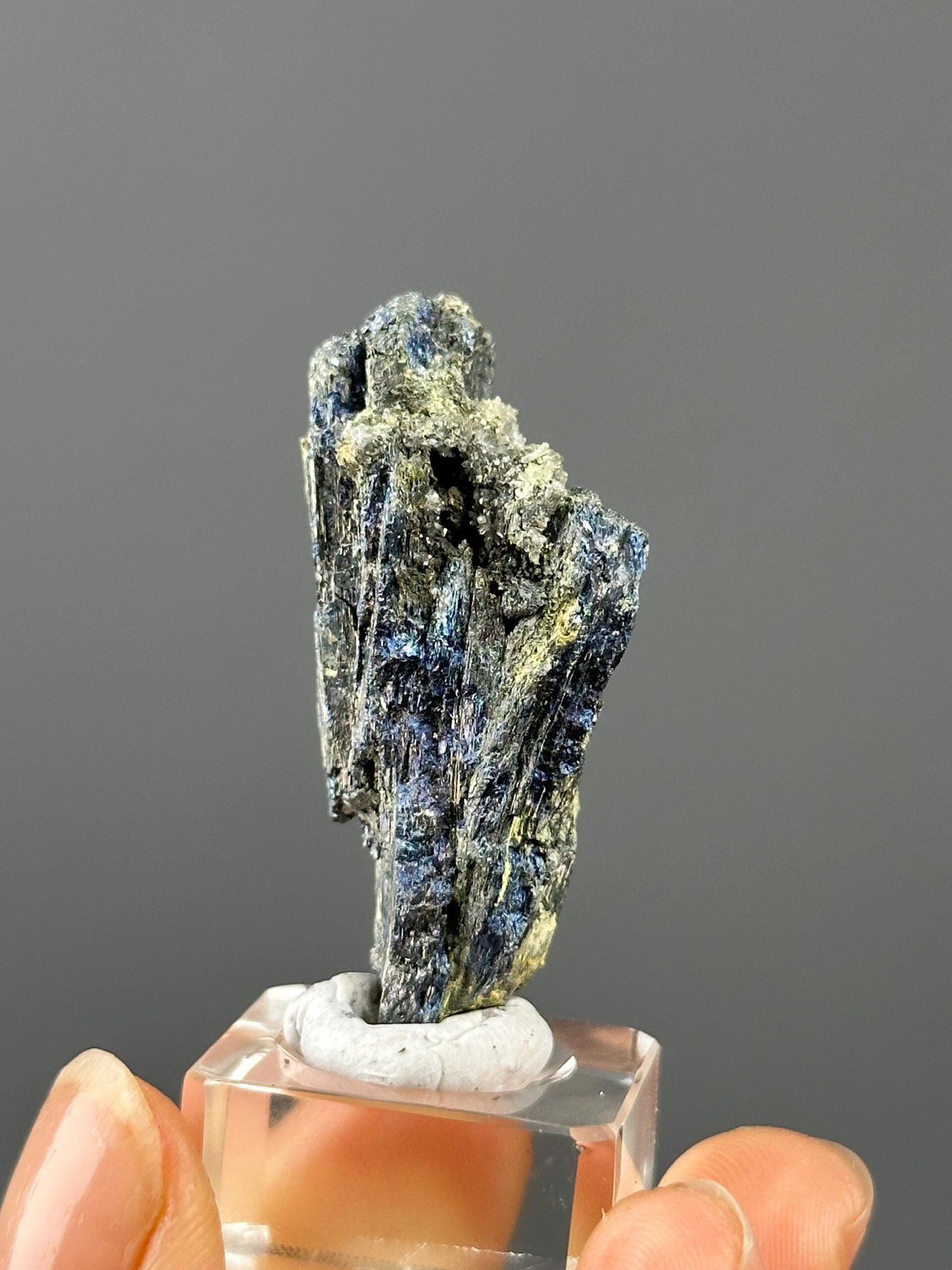 Back view of Hunan raw iridescent stibnite crystal