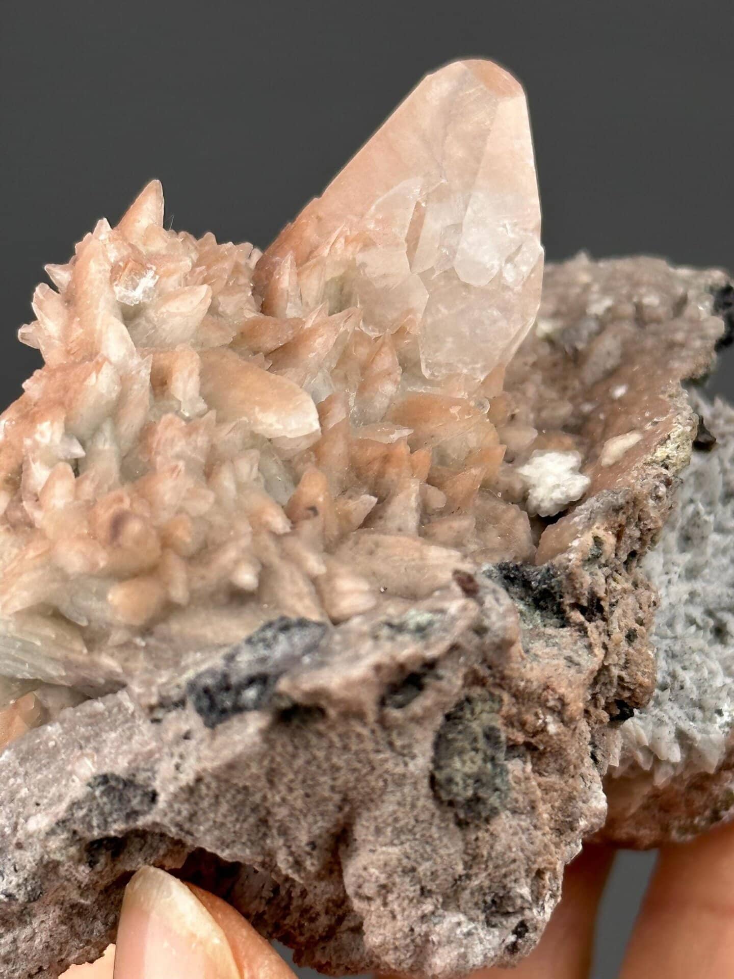 Angled view of fluorescent calcite on matrix