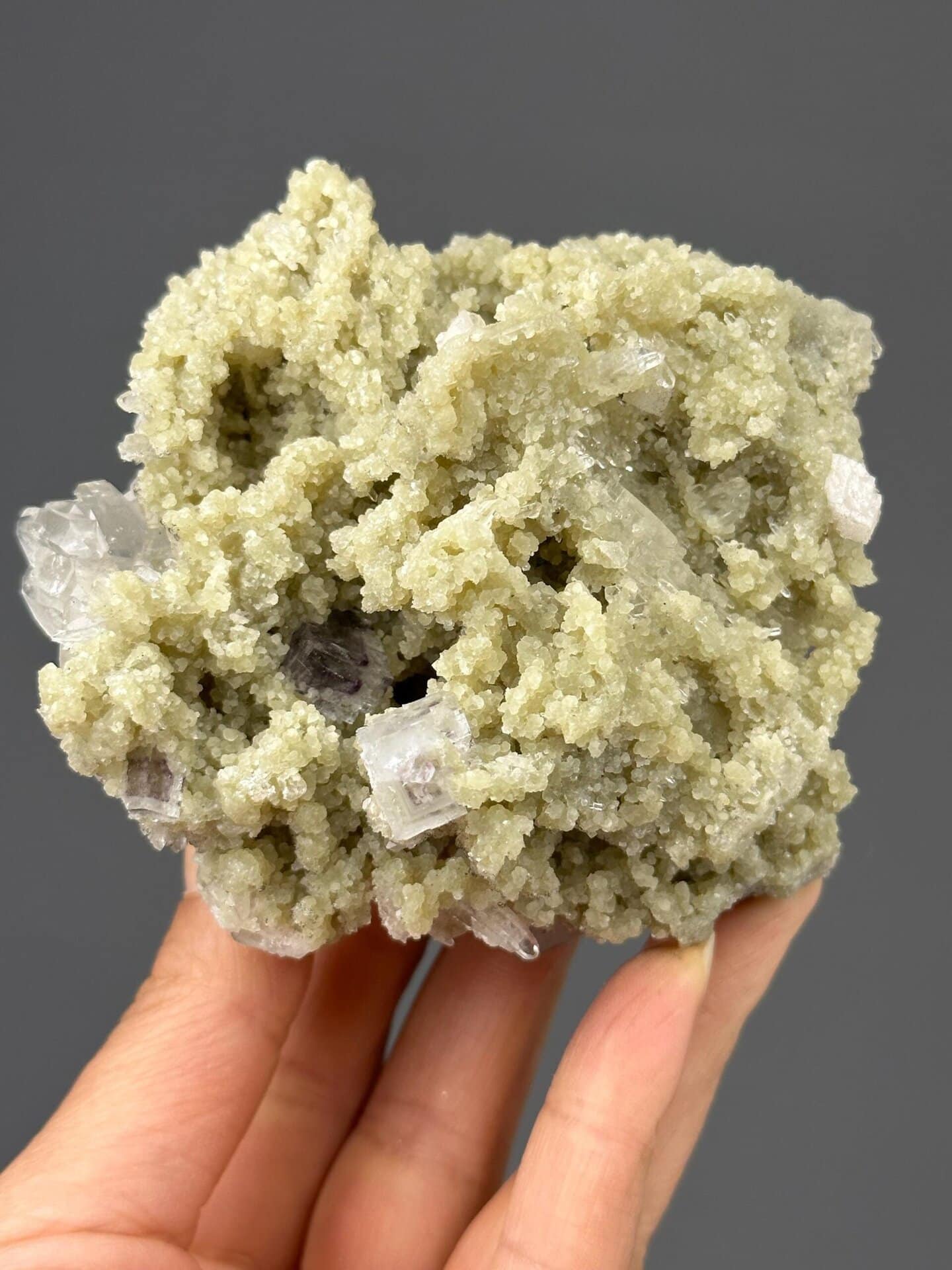 Front view of green fluorite embedded in dolomite matrix
