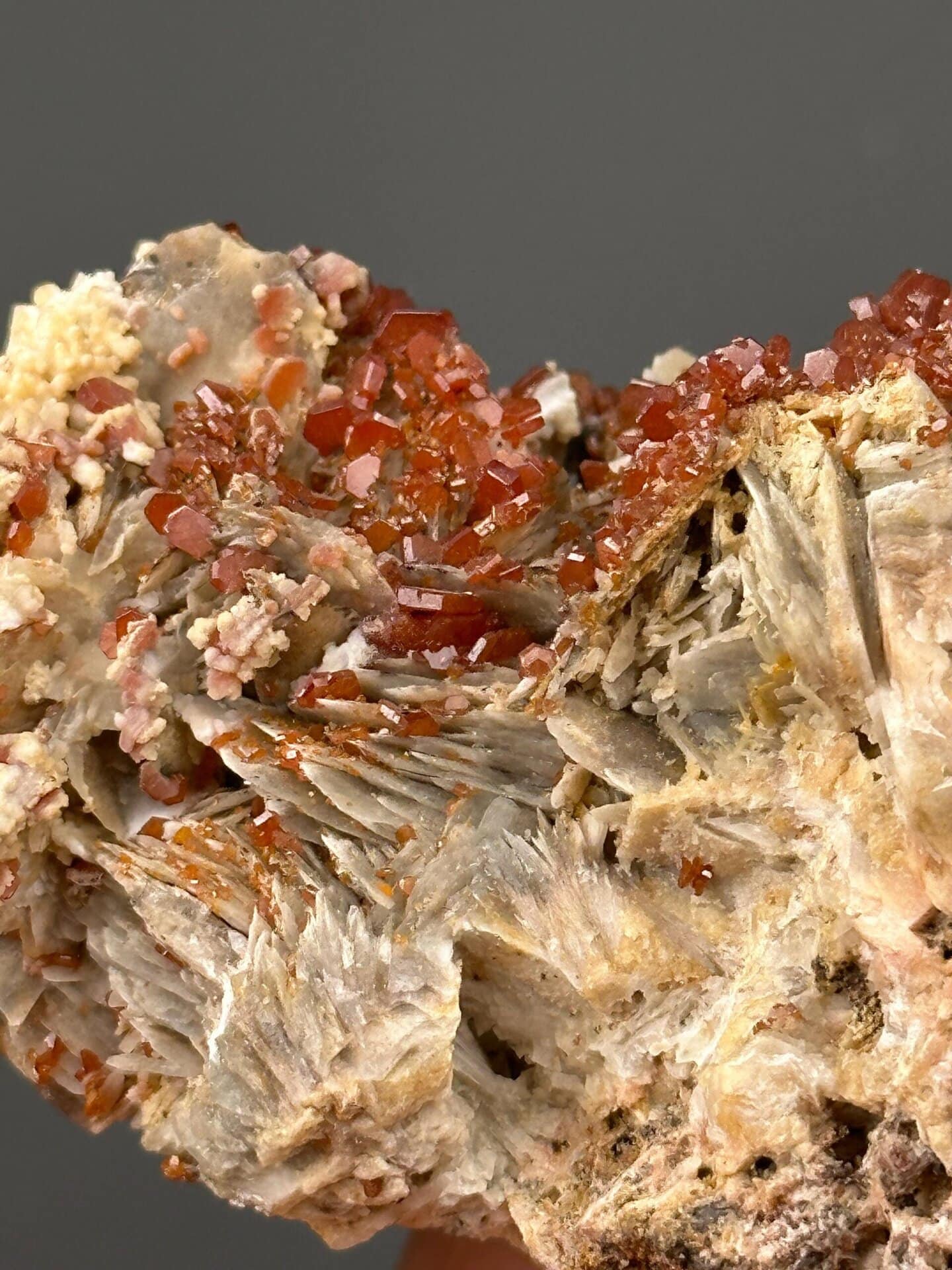 Close-up of red vanadinite crystals showing adamantine luster